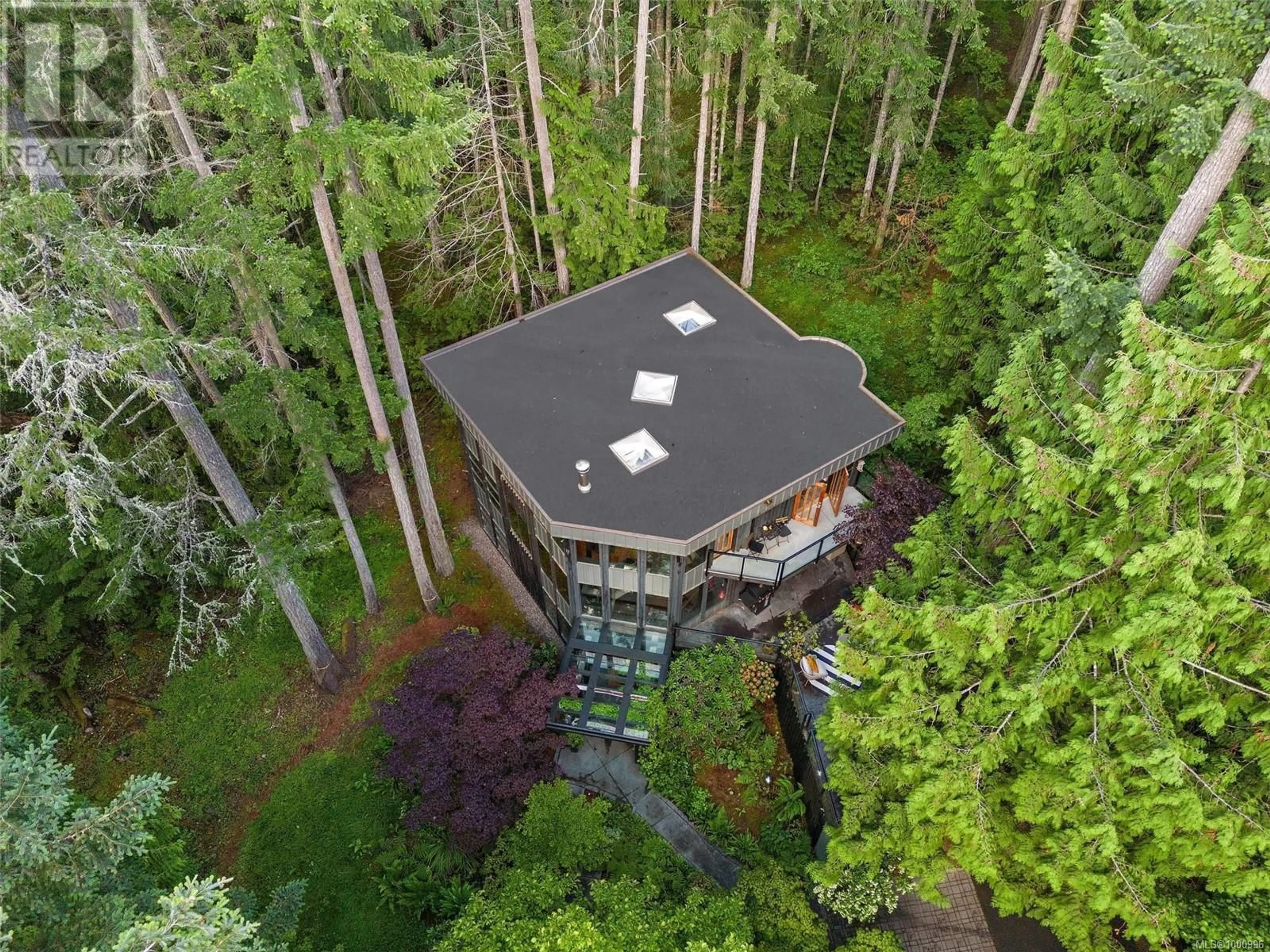 A pic from outside/outdoor area/front of a property/back of a property/a pic from drone, forest/trees view for 1457 HOWCREST ROAD, North Saanich British Columbia V8L5K1
