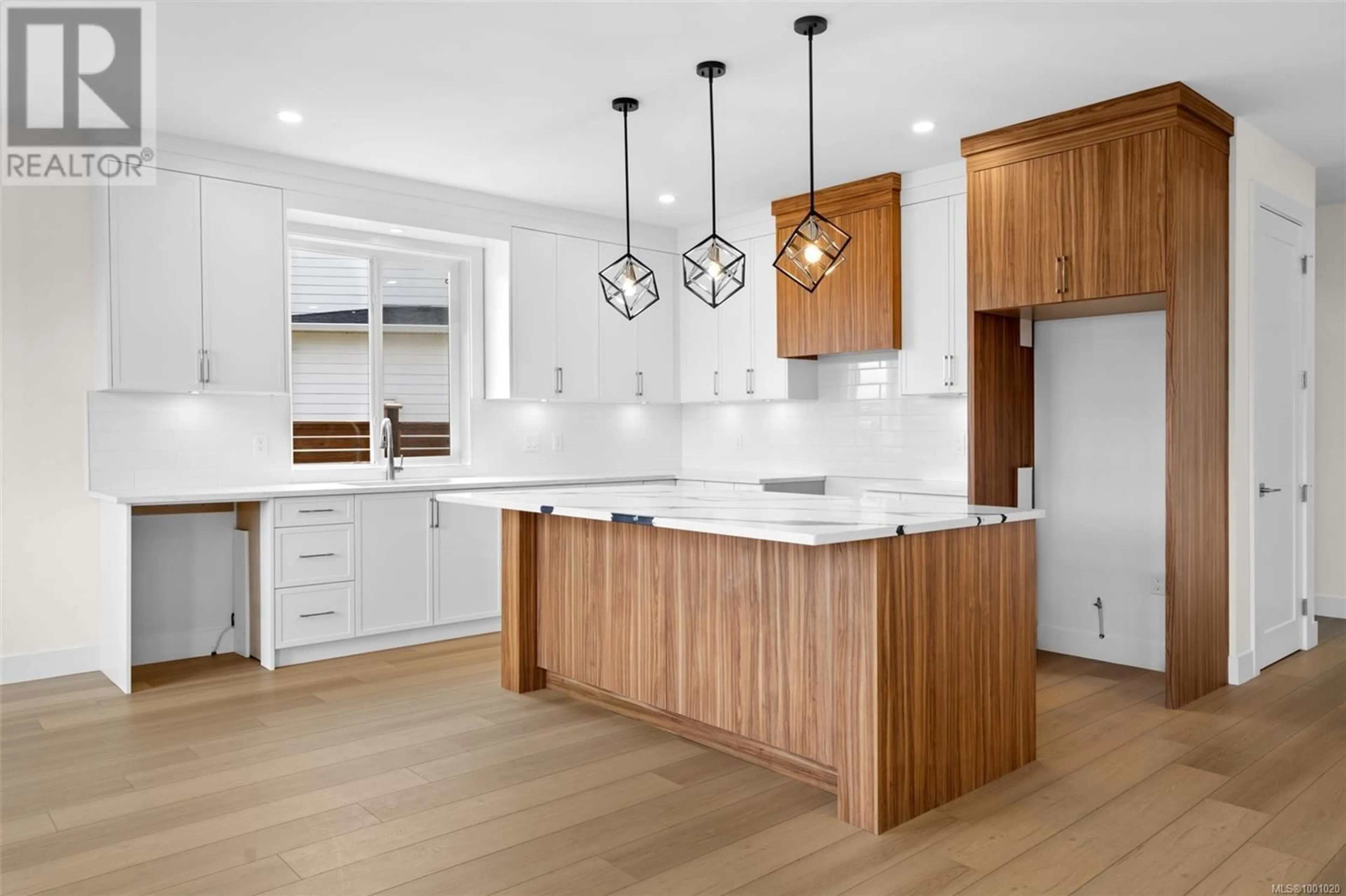 Open concept kitchen, wood/laminate floor for 2307 SWALLOW PLACE, Langford British Columbia V9B6W2
