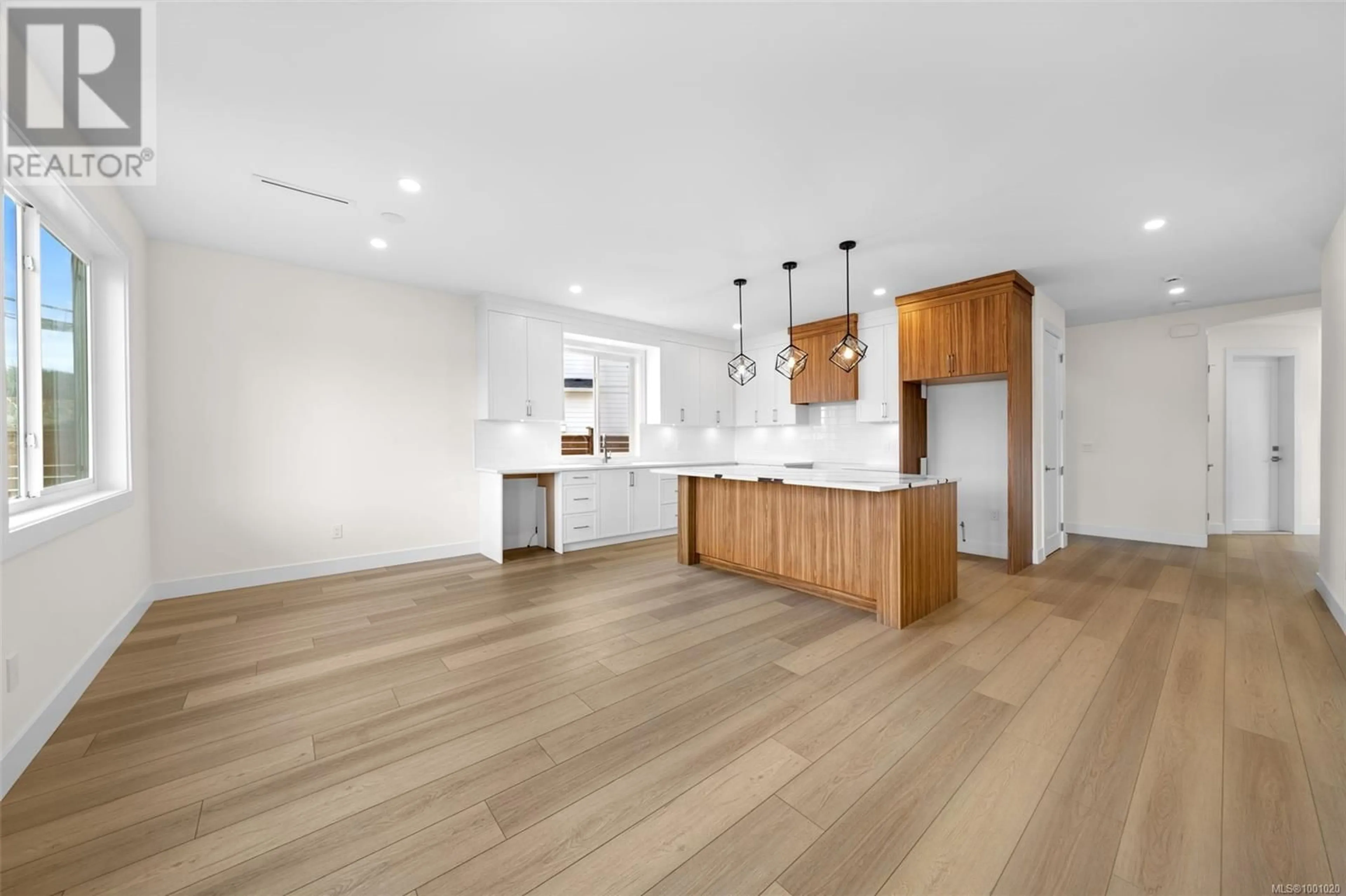 Open concept kitchen, wood/laminate floor for 2307 SWALLOW PLACE, Langford British Columbia V9B6W2
