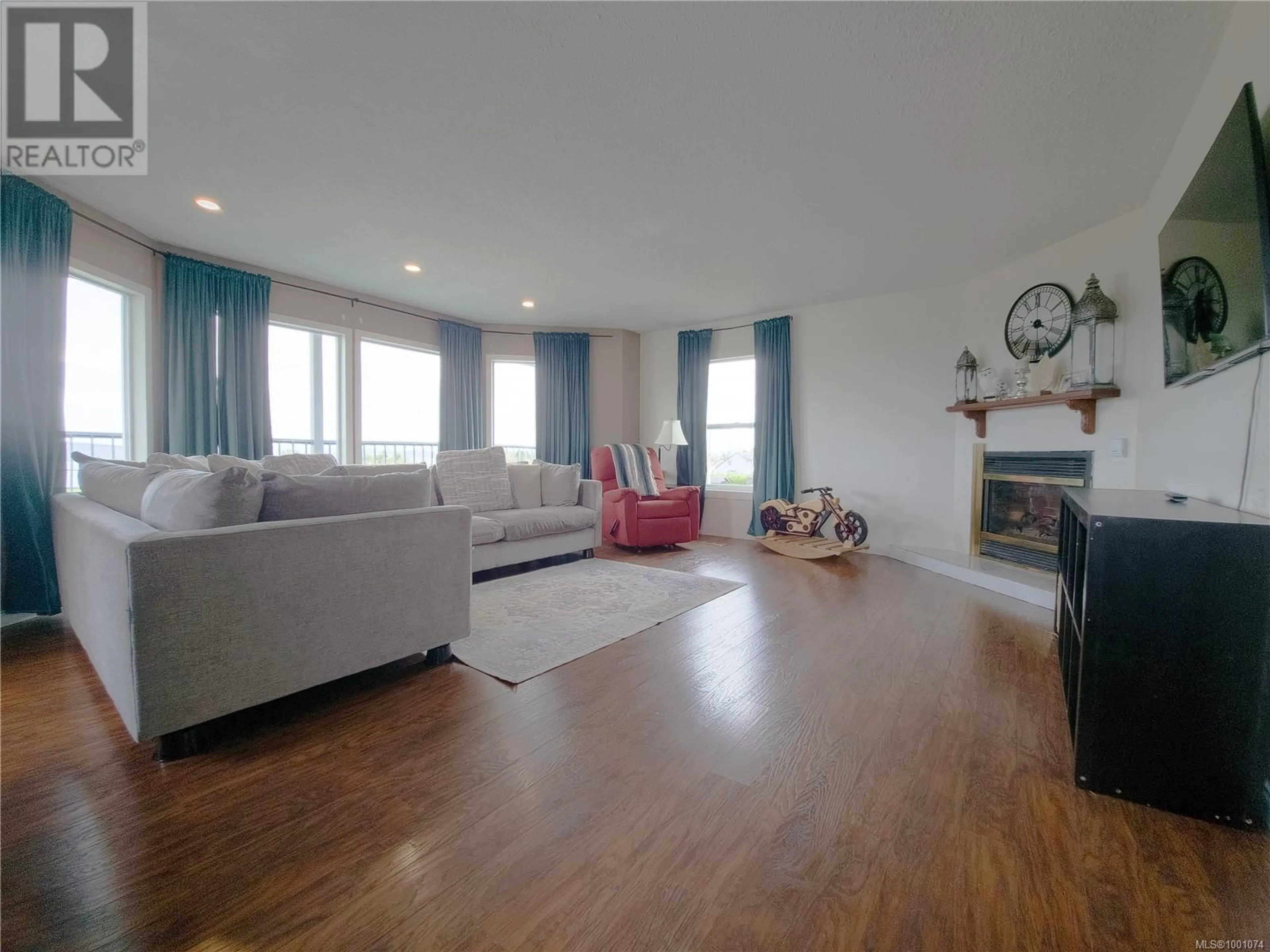 Living room with furniture, wood/laminate floor for 2287 CHELOHSIN CRESCENT, Port McNeill British Columbia V0N2R0