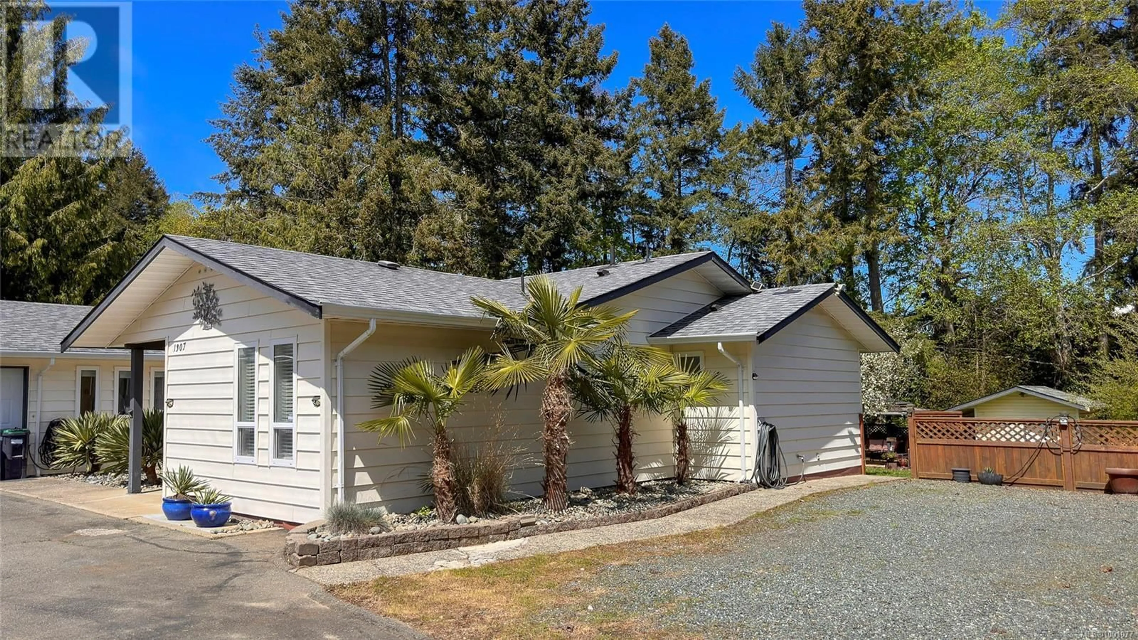 Home with vinyl exterior material, street for 1307 SUNRISE DRIVE, French Creek British Columbia V9P1X4