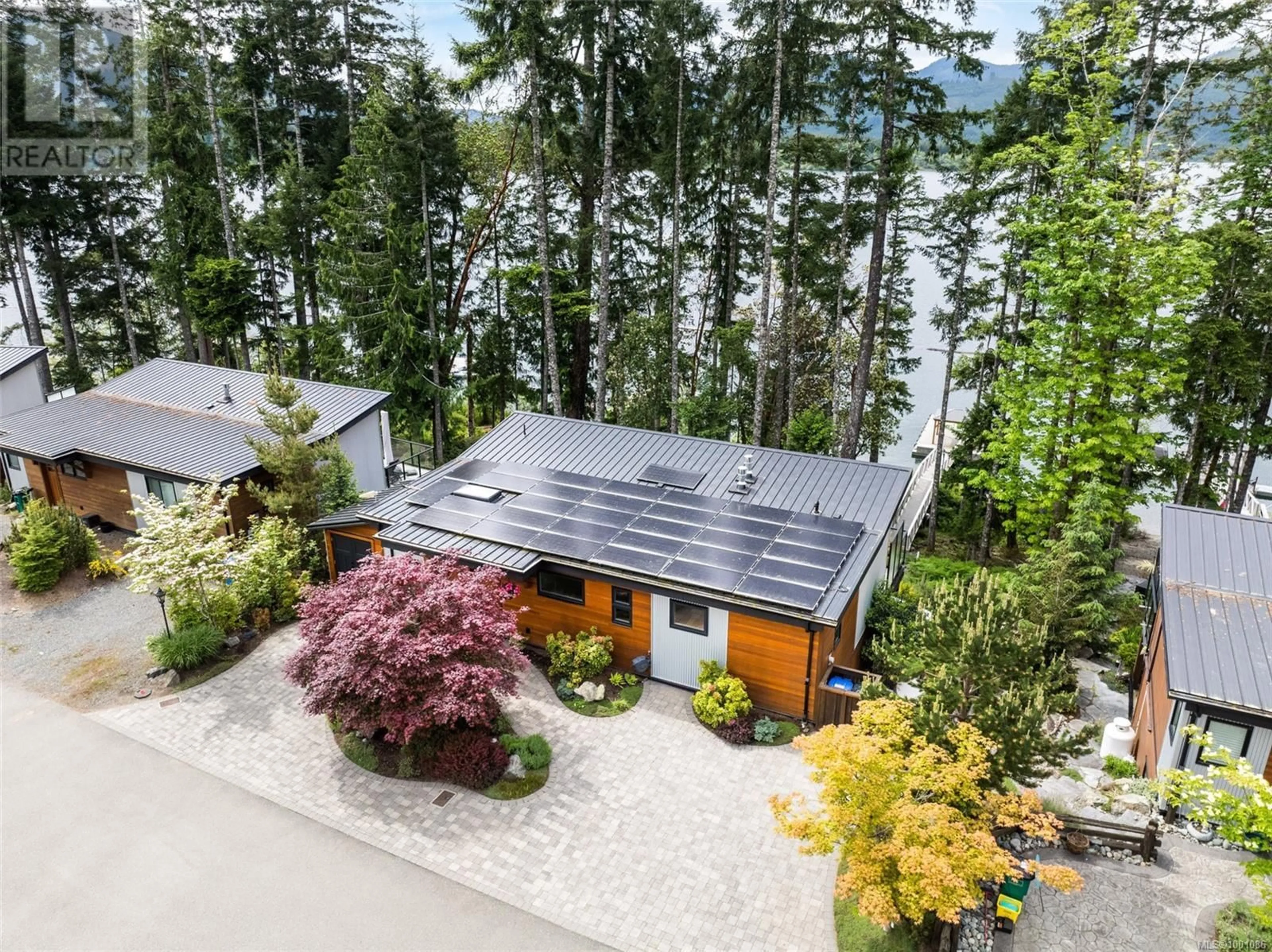 A pic from outside/outdoor area/front of a property/back of a property/a pic from drone, water/lake/river/ocean view for 7424 COTTAGE WAY, Lake Cowichan British Columbia V0R2G1