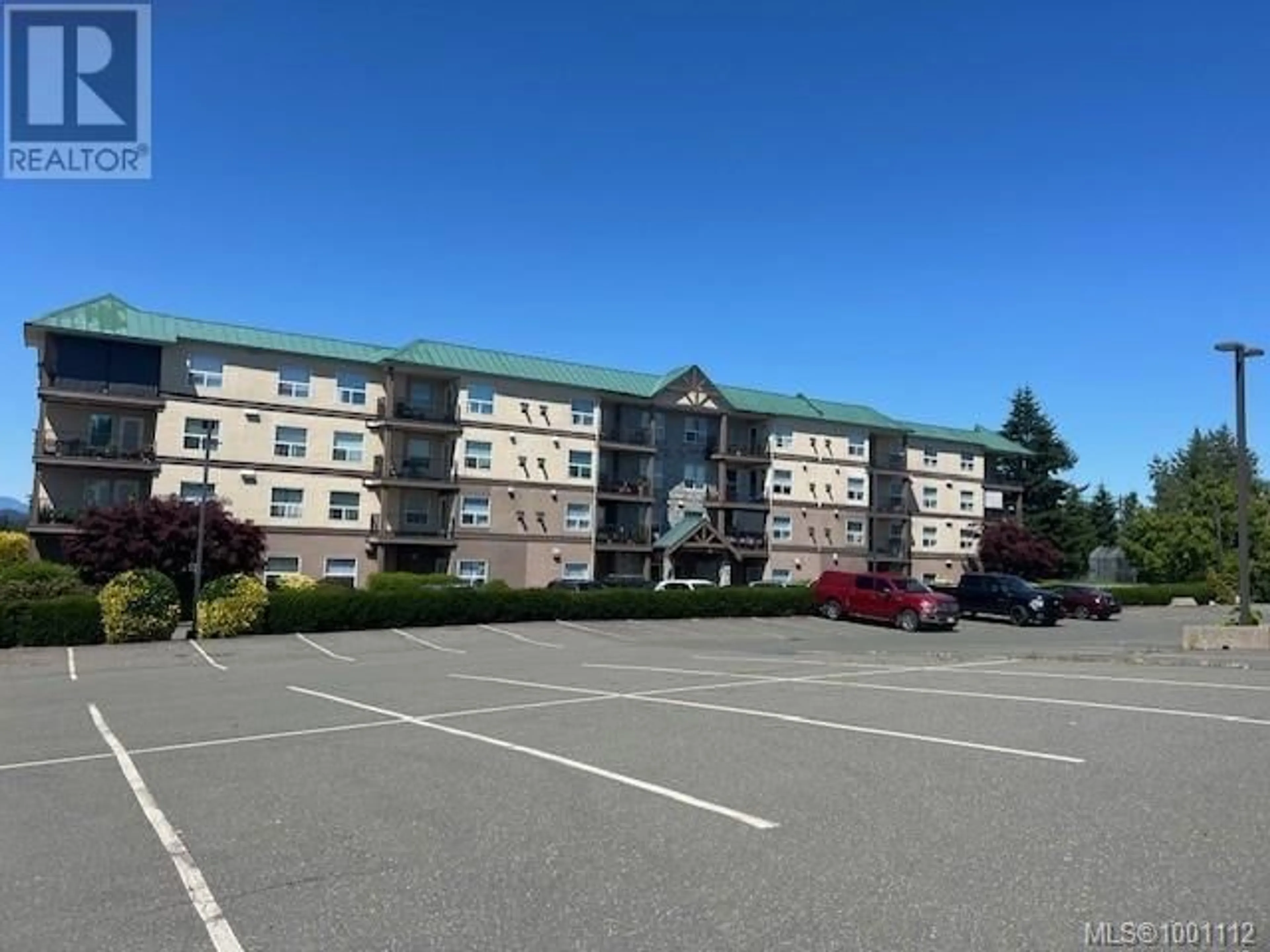A pic from outside/outdoor area/front of a property/back of a property/a pic from drone, unknown for 407 - 280 DOGWOOD STREET SOUTH, Campbell River British Columbia V9W6Y7