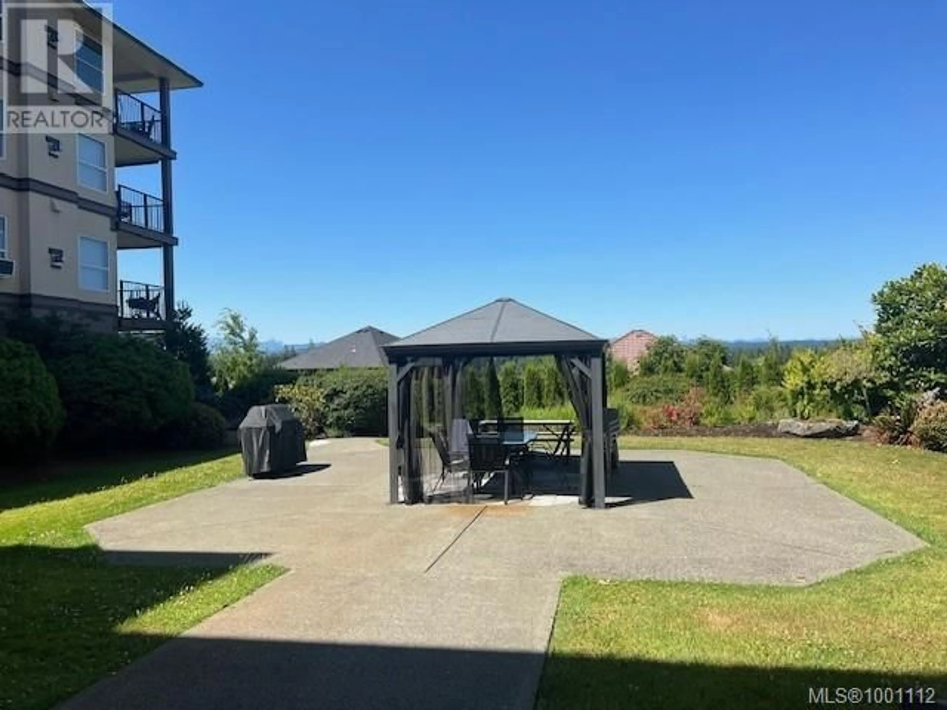 A pic from outside/outdoor area/front of a property/back of a property/a pic from drone, water/lake/river/ocean view for 407 - 280 DOGWOOD STREET SOUTH, Campbell River British Columbia V9W6Y7