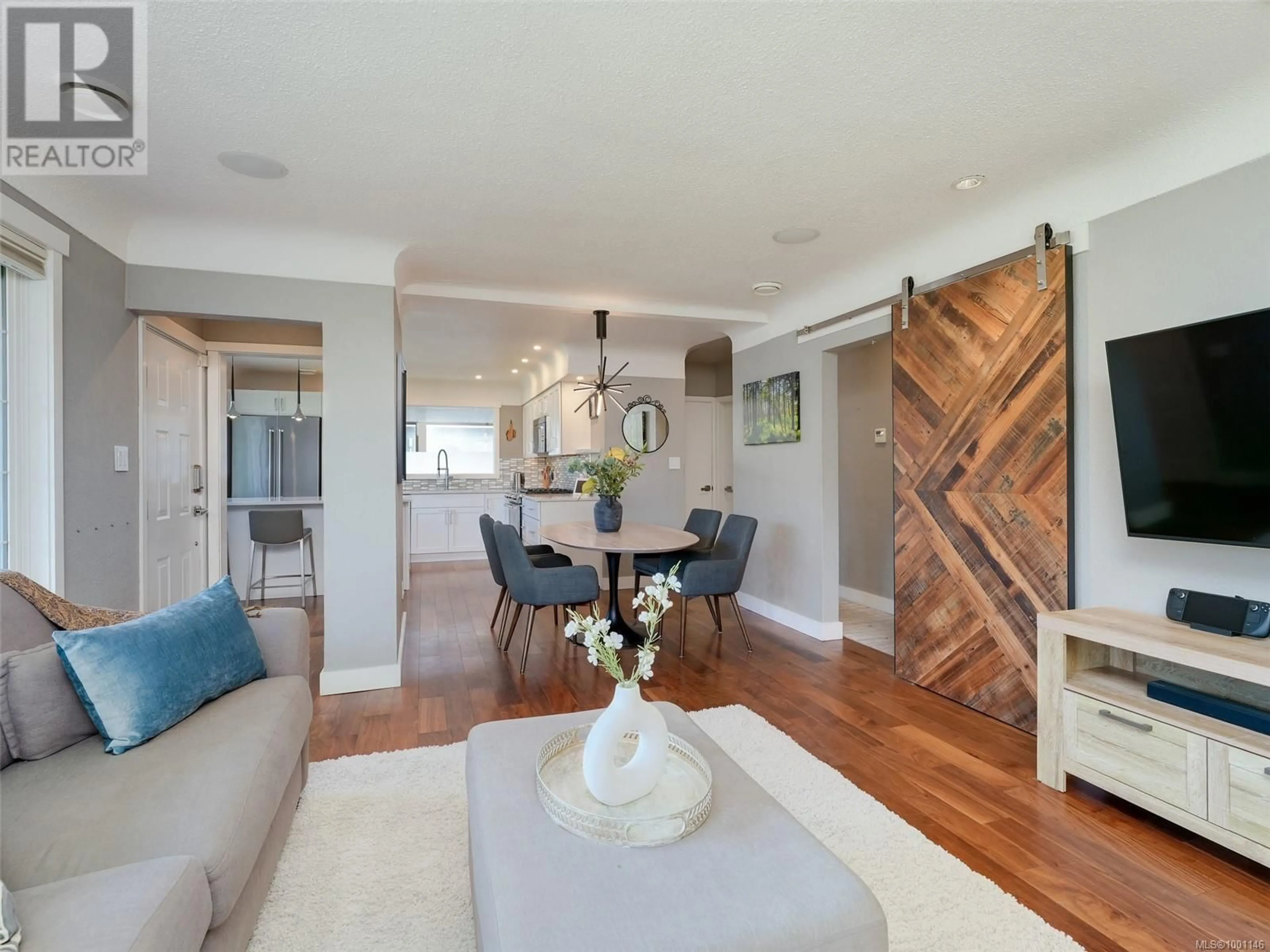 Living room with furniture, wood/laminate floor for 3756 SEATON STREET, Saanich British Columbia V8Z3W4