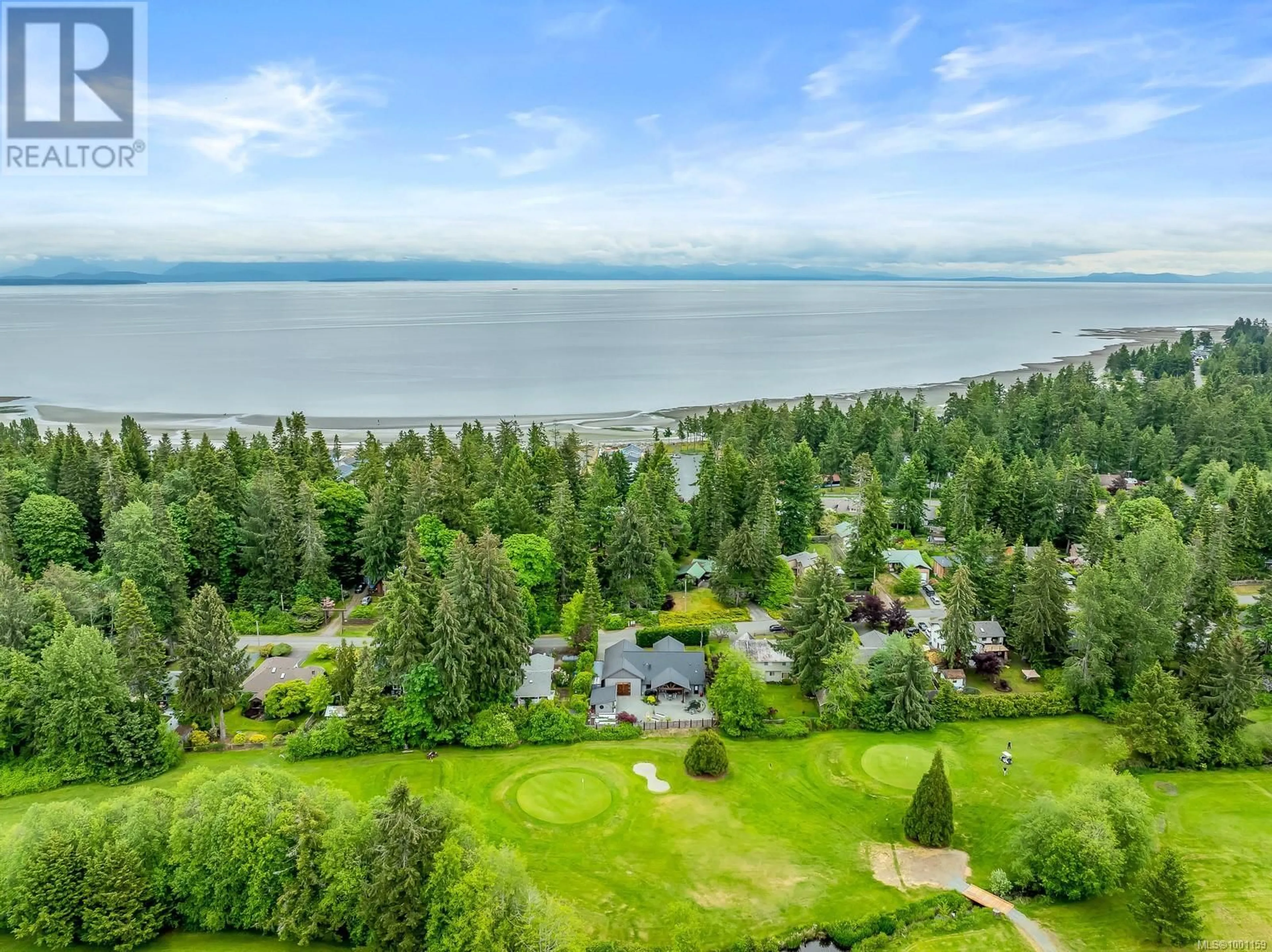 A pic from outside/outdoor area/front of a property/back of a property/a pic from drone, water/lake/river/ocean view for 8899 HENDERSON AVENUE, Black Creek British Columbia V9J1A5