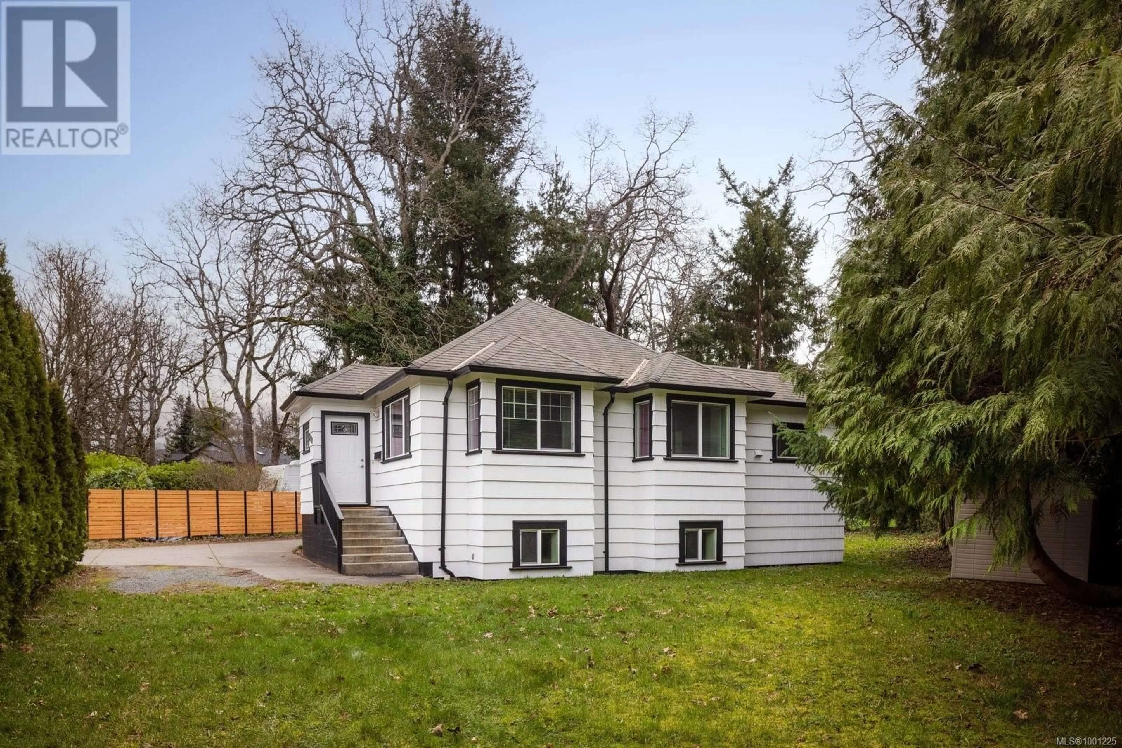 Home with vinyl exterior material, street for 3918 CEDAR HILL CROSS ROAD, Saanich British Columbia V8P2N2