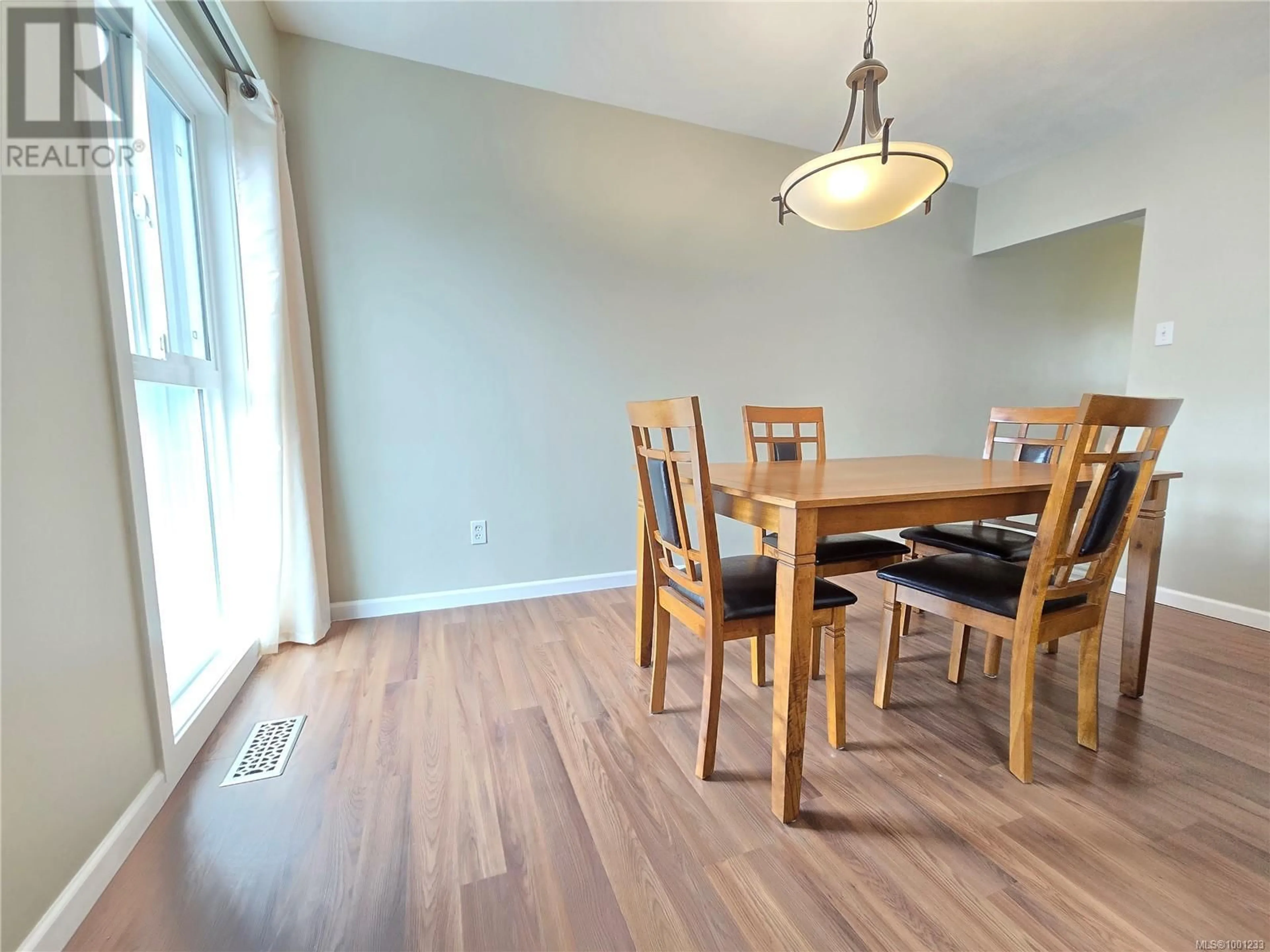 Dining room, wood/laminate floor for 69 MCKAY CRESCENT, Port Alice British Columbia V0N2N0