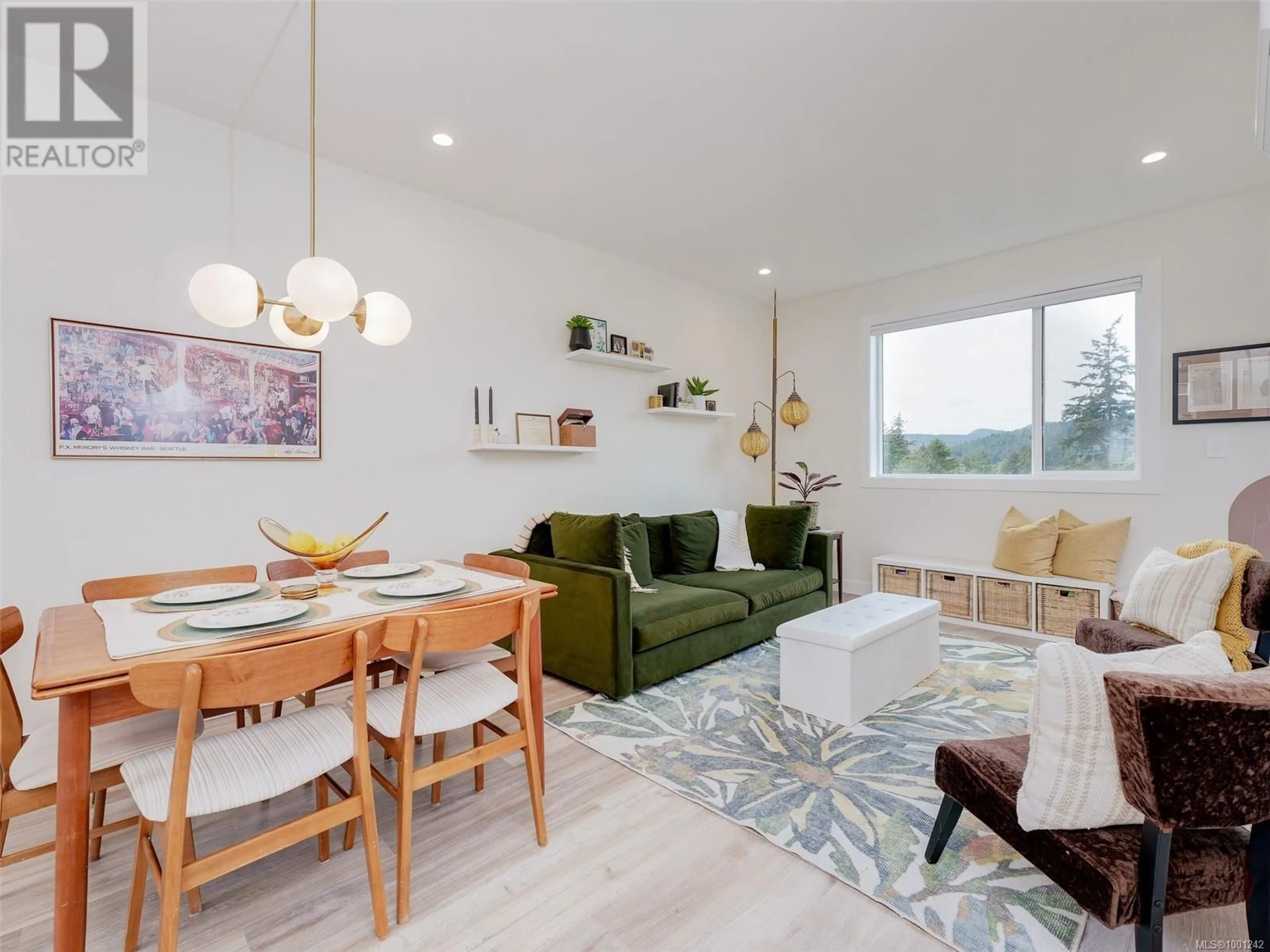 Living room with furniture, wood/laminate floor for 102 - 3559 VISION WAY, Langford British Columbia V9C0C4