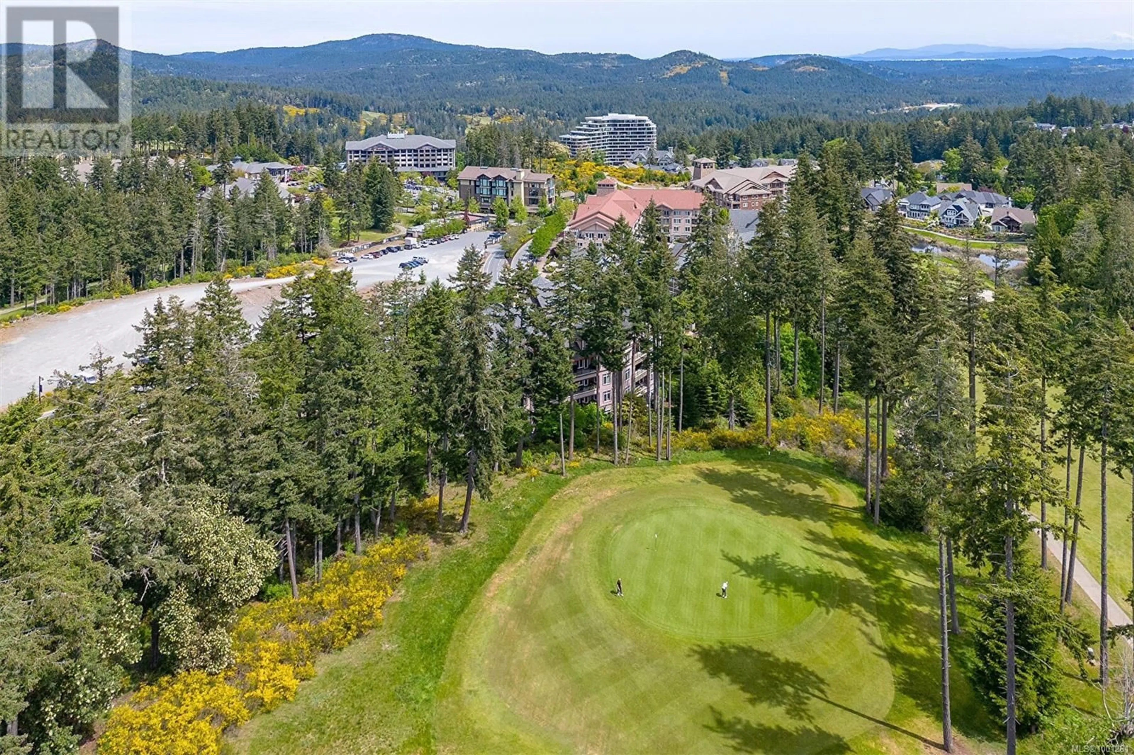 A pic from outside/outdoor area/front of a property/back of a property/a pic from drone, forest/trees view for 212 - 1395 BEAR MOUNTAIN PARKWAY, Langford British Columbia V9B0E1
