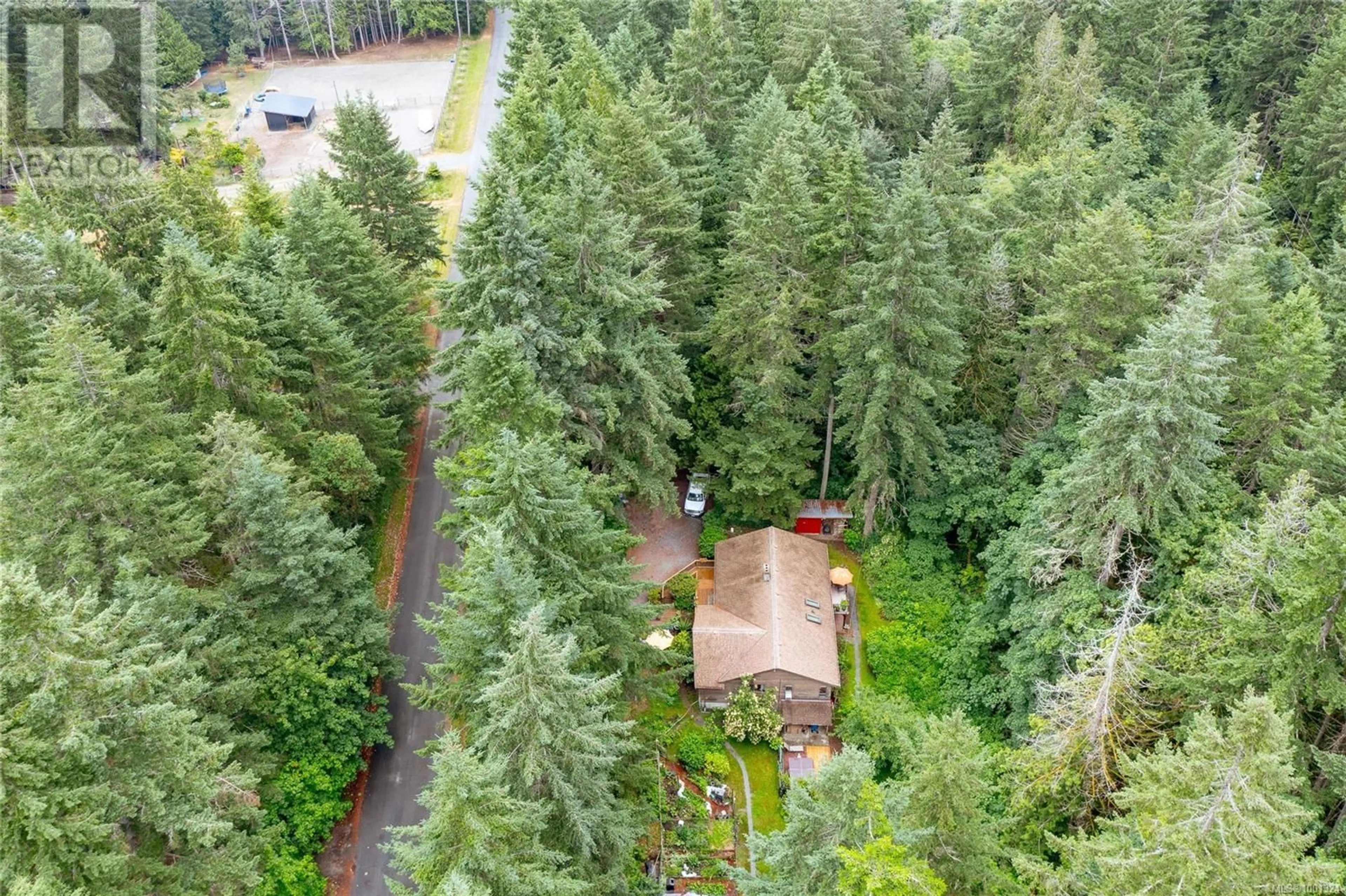 A pic from outside/outdoor area/front of a property/back of a property/a pic from drone, forest/trees view for 3345 MCGUIRE WAY, Nanaimo British Columbia V0R2E0