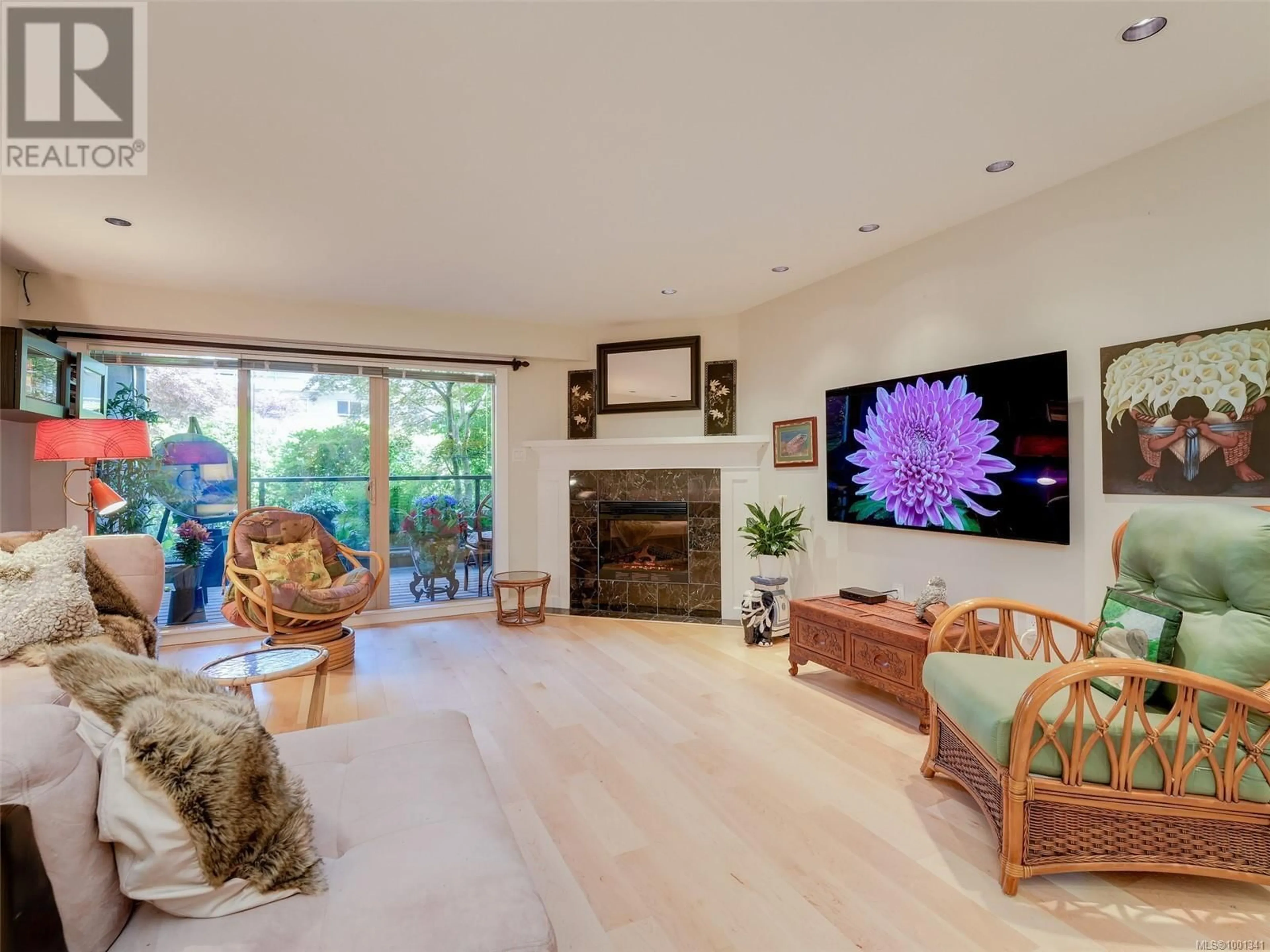 Living room with furniture, wood/laminate floor for 108 - 1419 STADACONA AVENUE, Victoria British Columbia V8S5J3
