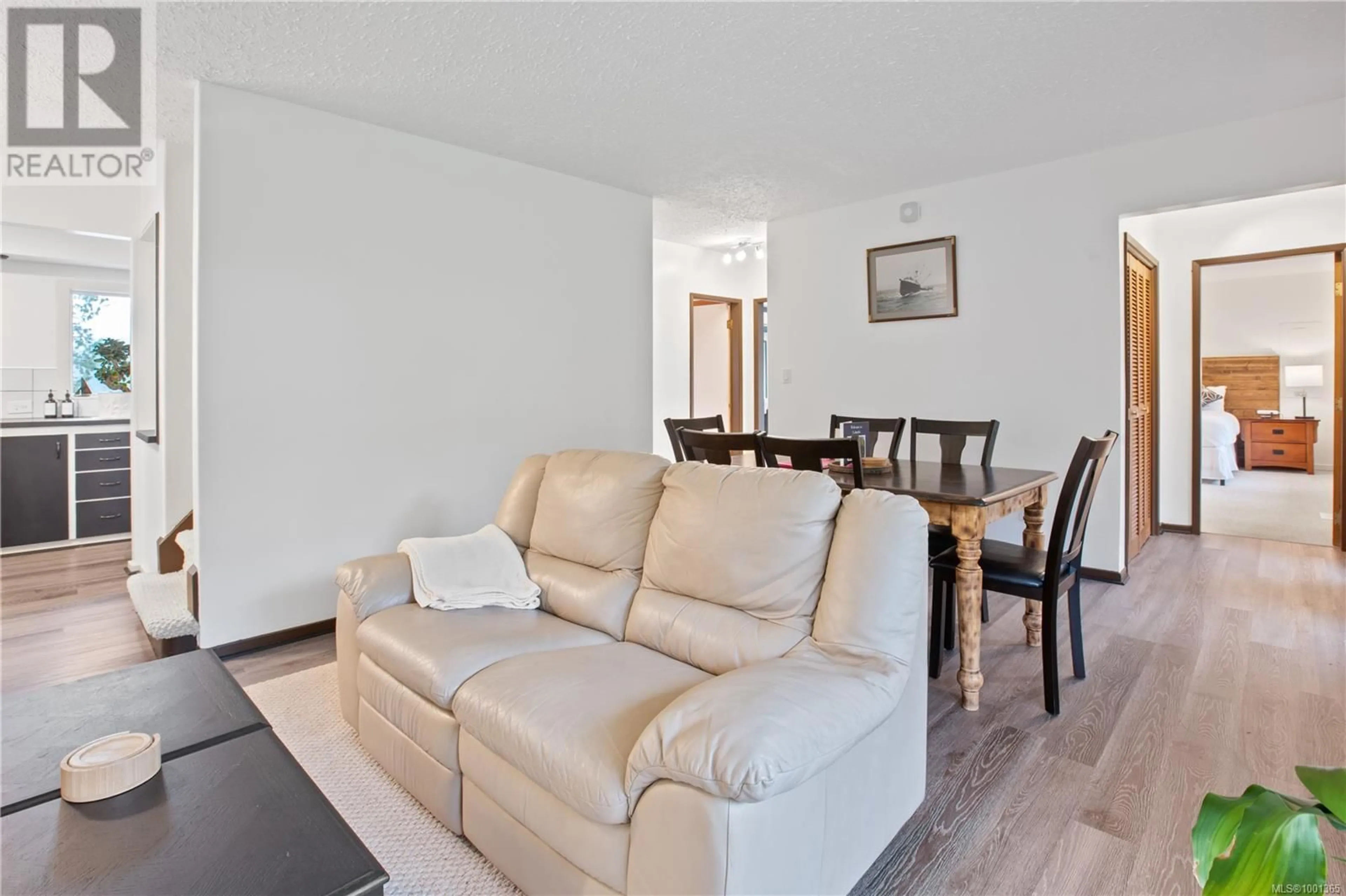 Living room with furniture, wood/laminate floor for 232 ALBION CRESCENT, Ucluelet British Columbia V0R3A0