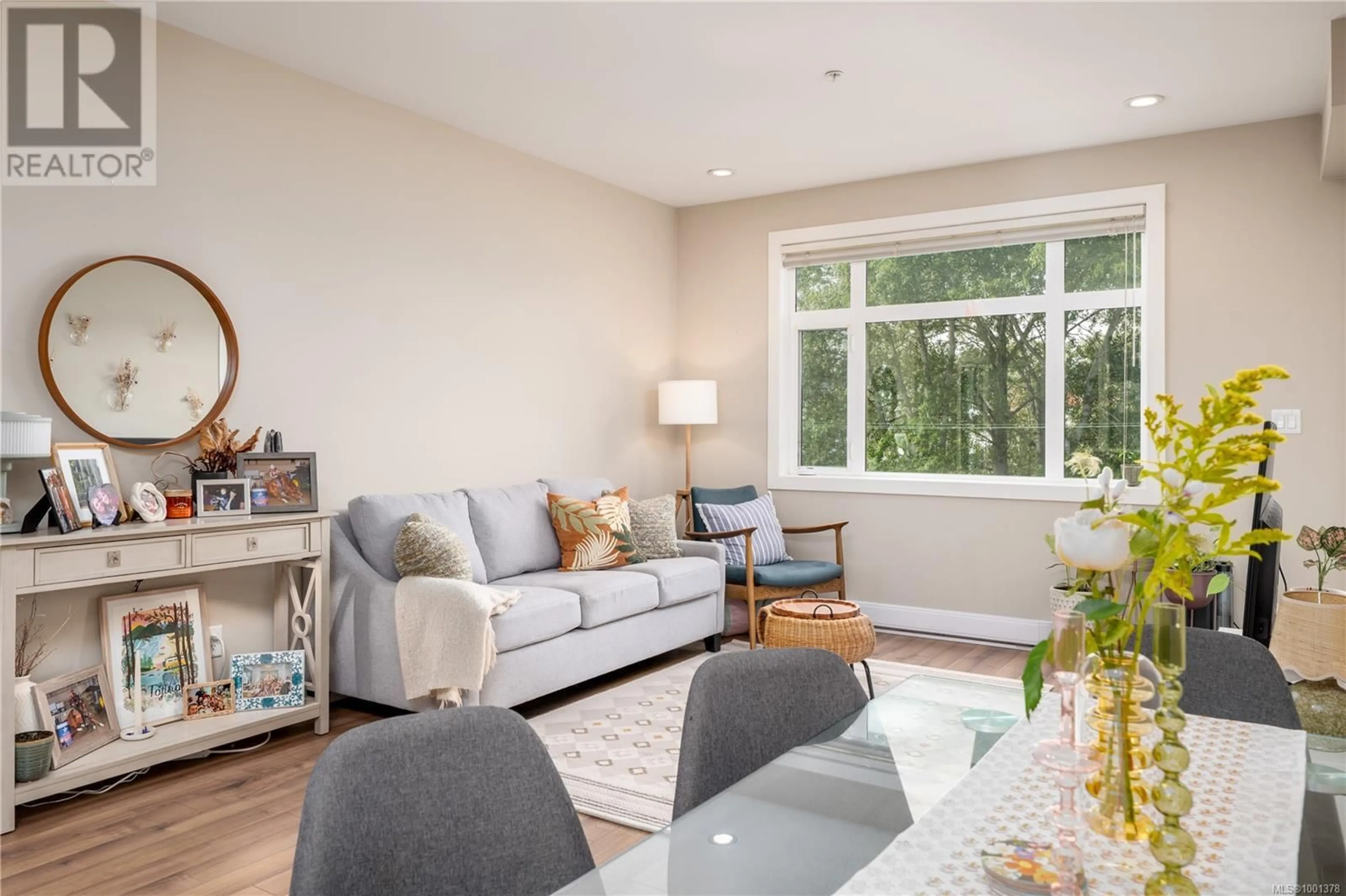 Living room with furniture, wood/laminate floor for 310 - 2655 SOOKE ROAD, Langford British Columbia V9B1Y3