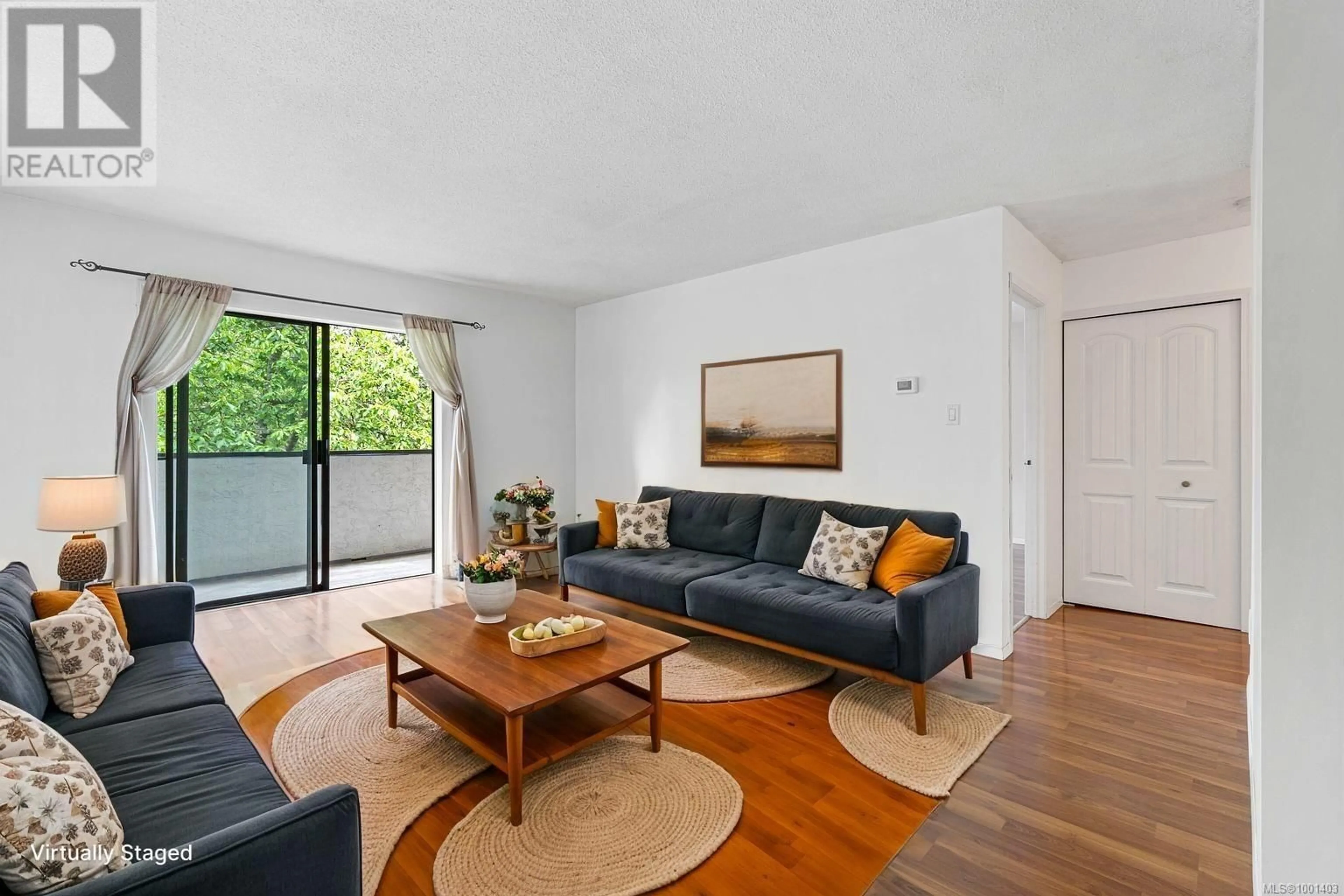 Living room with furniture, wood/laminate floor for 309 - 550 BRADLEY STREET, Nanaimo British Columbia V9S5N4