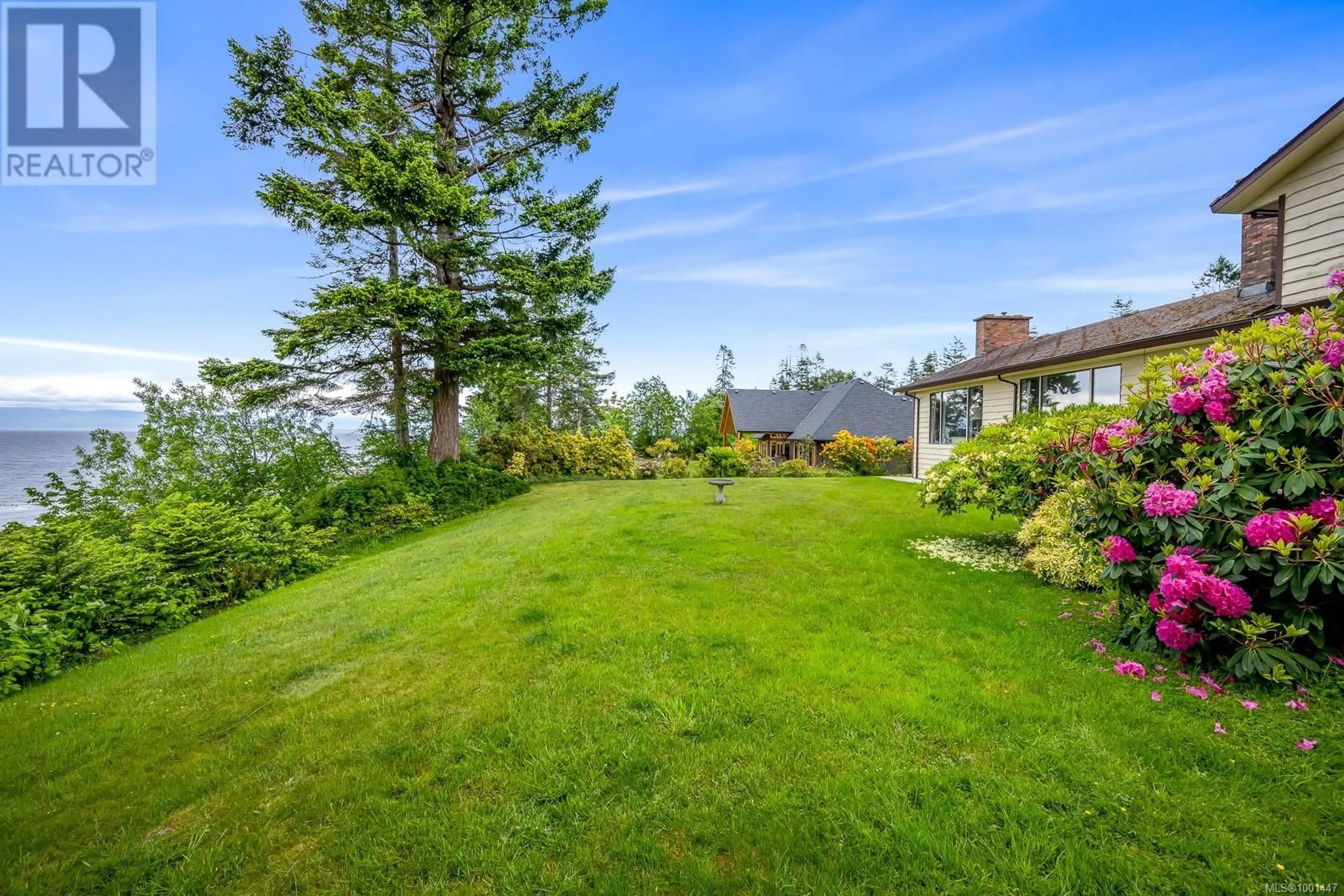 A pic from outside/outdoor area/front of a property/back of a property/a pic from drone, water/lake/river/ocean view for 2376 SEABANK ROAD, Courtenay British Columbia V9J1X5
