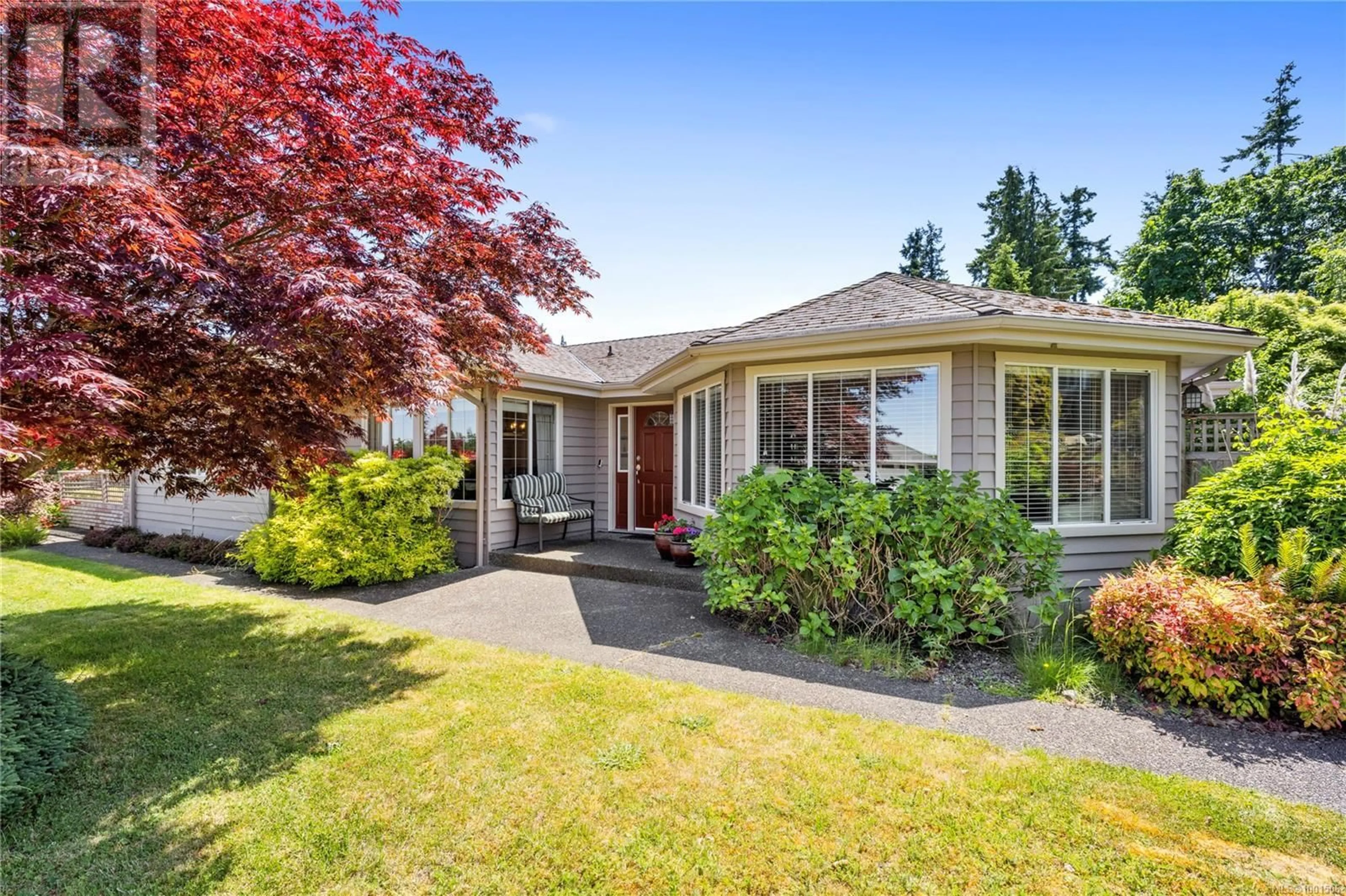 Home with vinyl exterior material, street for 910 FAIRWAYS DRIVE, Qualicum Beach British Columbia V9K1E1