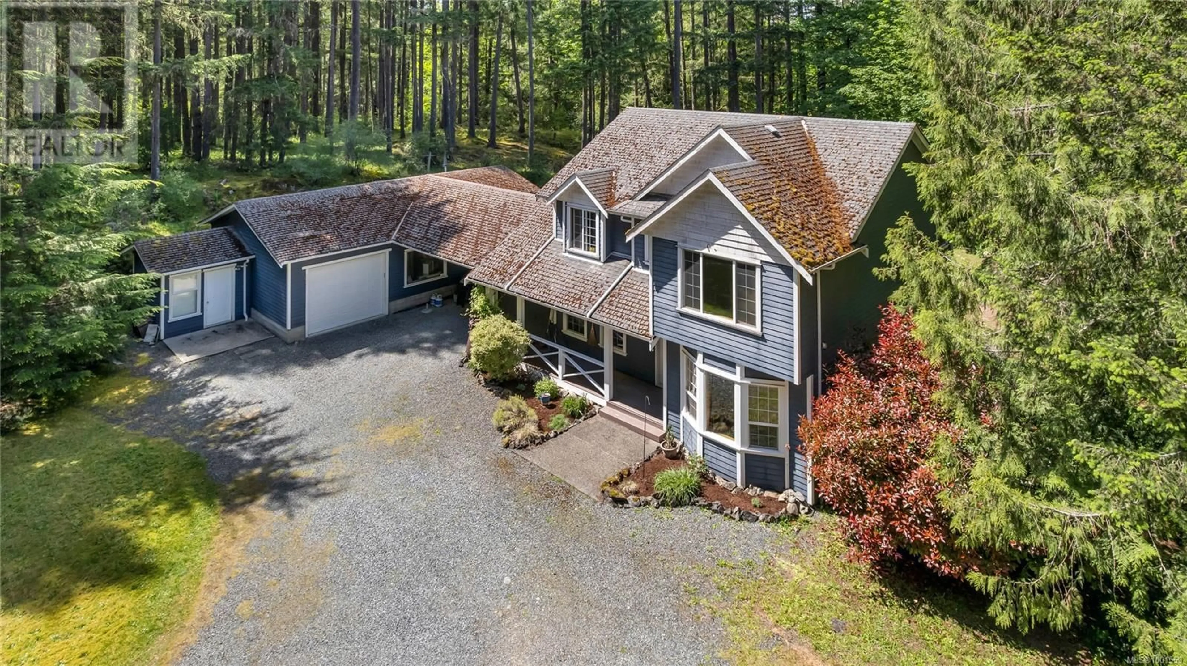 A pic from outside/outdoor area/front of a property/back of a property/a pic from drone, street for 1850 LAKEWOOD ROAD, Shawnigan Lake British Columbia V0R2W0