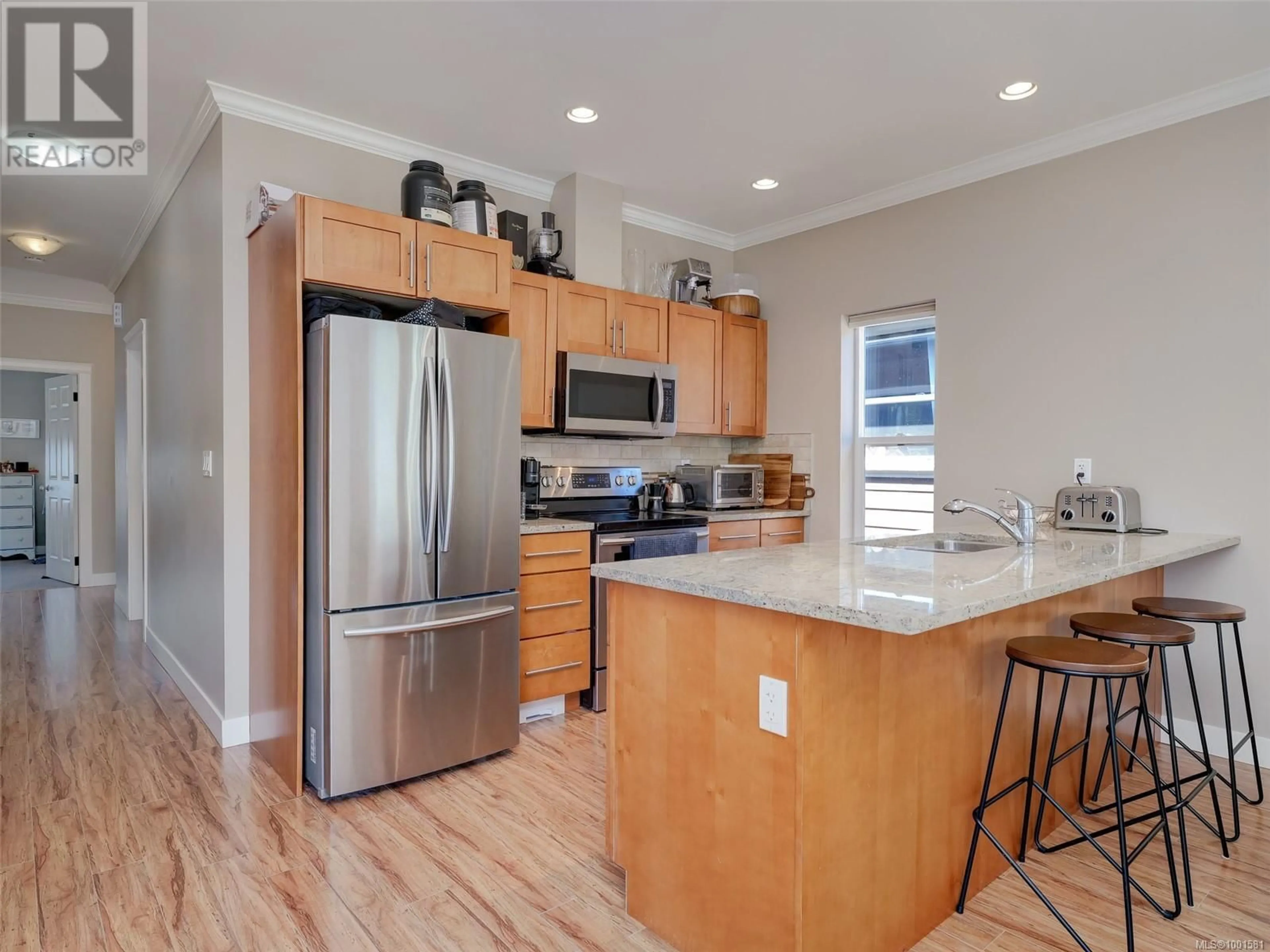 Open concept kitchen, wood/laminate floor for 3307 MERLIN ROAD, Langford British Columbia V9C0H3