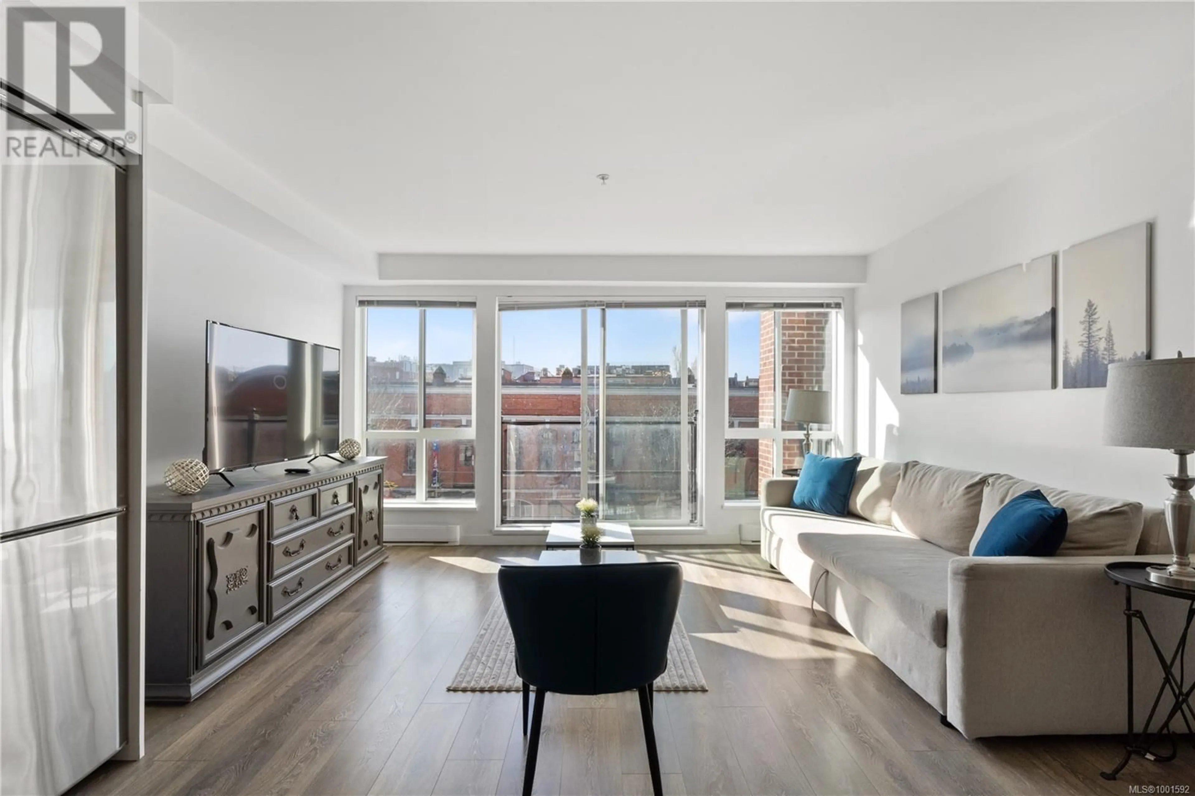 Living room with furniture, wood/laminate floor for 312 - 528 PANDORA AVENUE, Victoria British Columbia V8W0C6