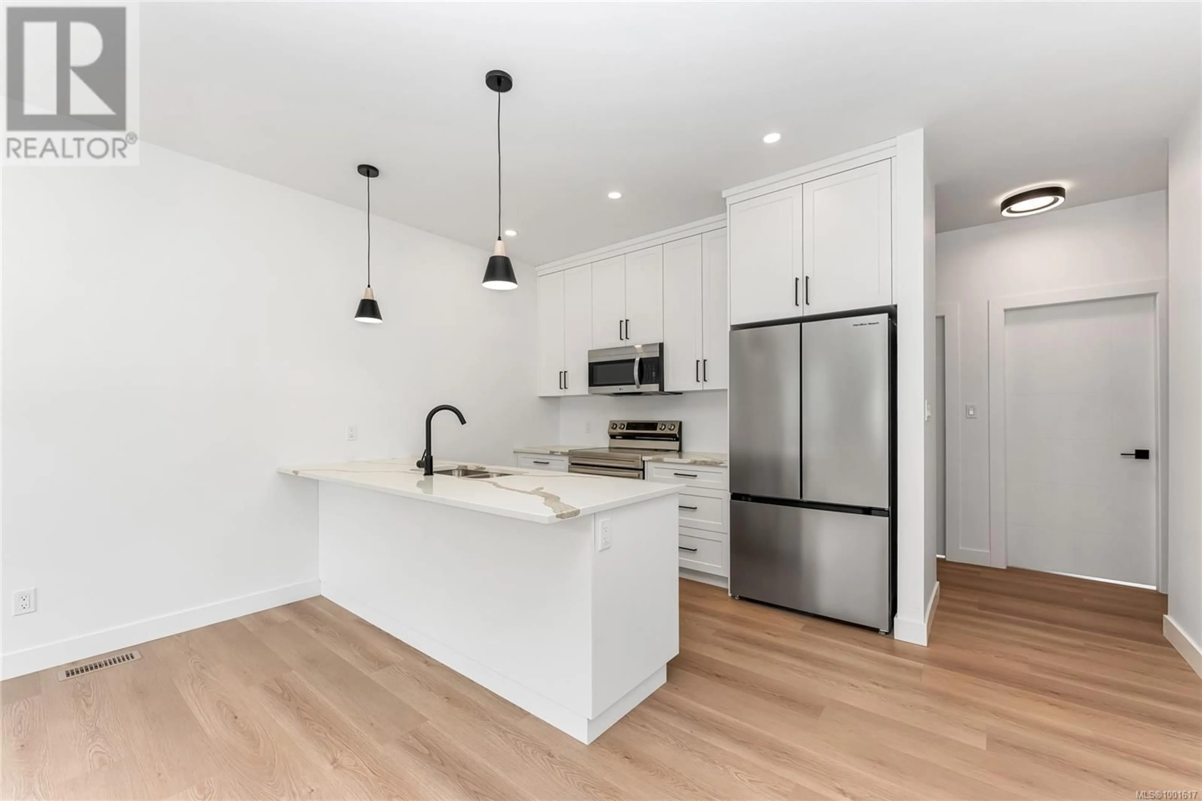 Open concept kitchen, wood/laminate floor for A - 122 PLANTE CRESCENT, Lake Cowichan British Columbia V0R2G0