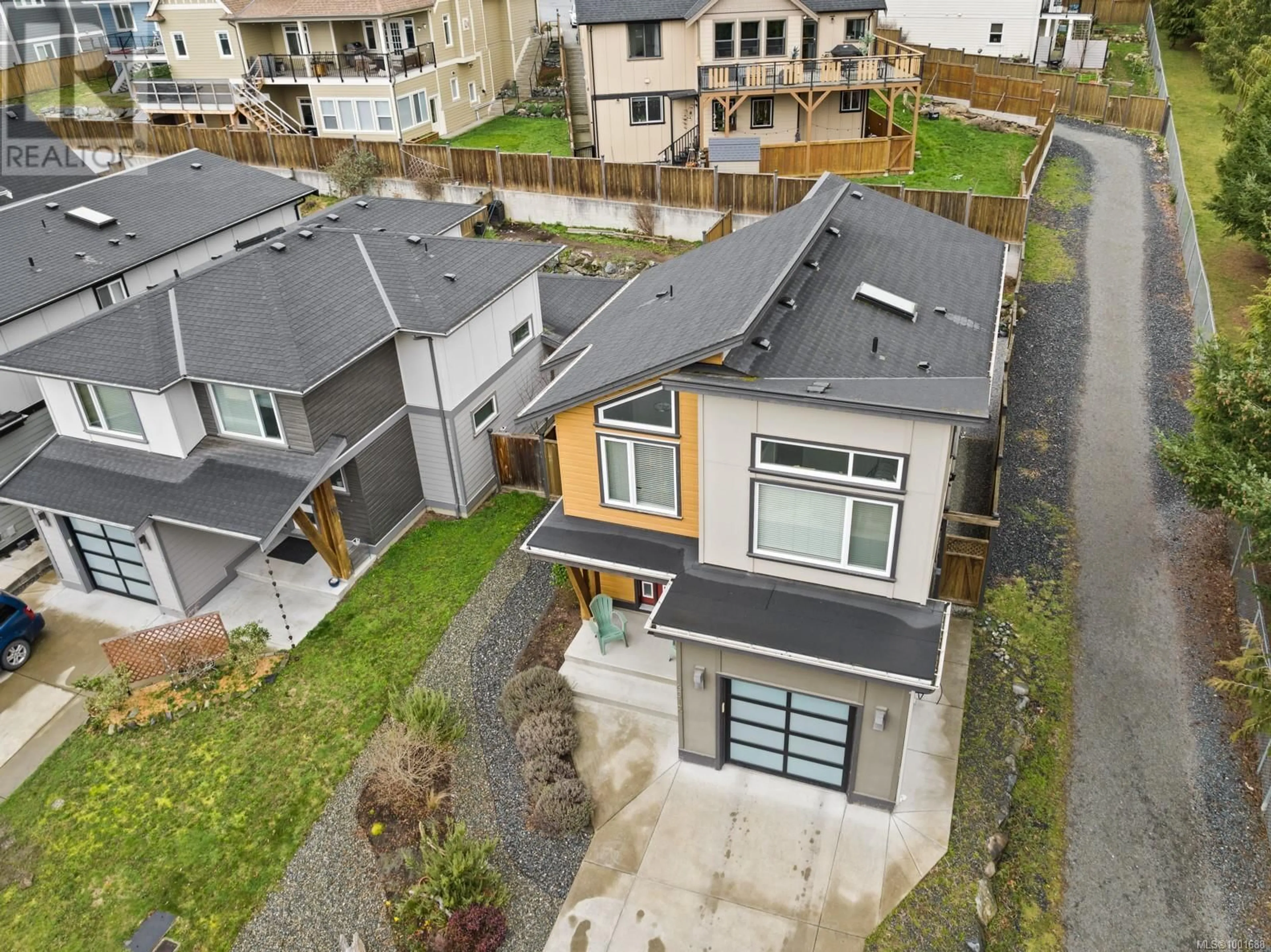 A pic from outside/outdoor area/front of a property/back of a property/a pic from drone, street for 6512 ARRANWOOD DRIVE, Sooke British Columbia V9Z0W4