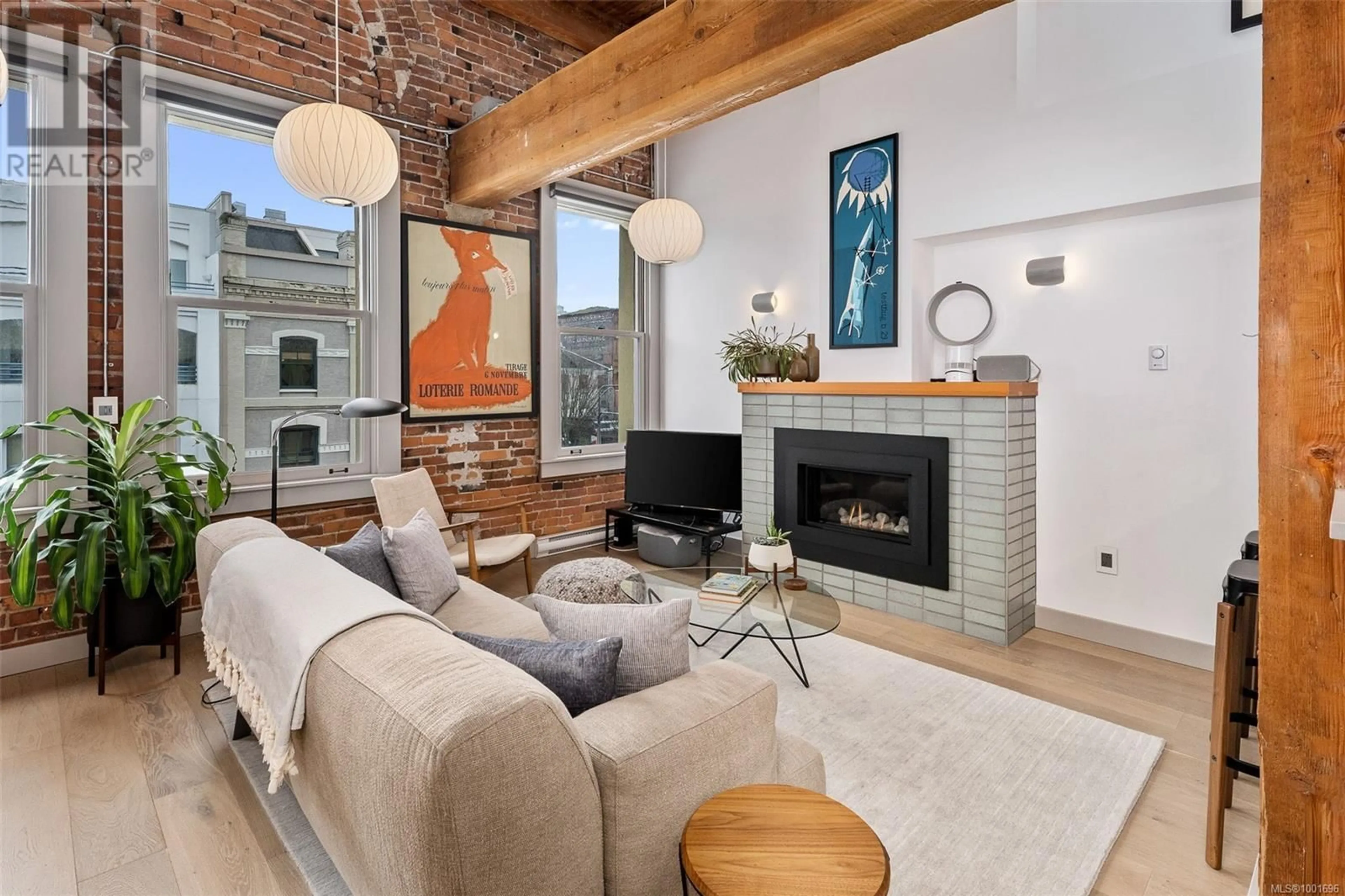 Living room with furniture, unknown for 317 - 599 PANDORA AVENUE, Victoria British Columbia V8W1N5