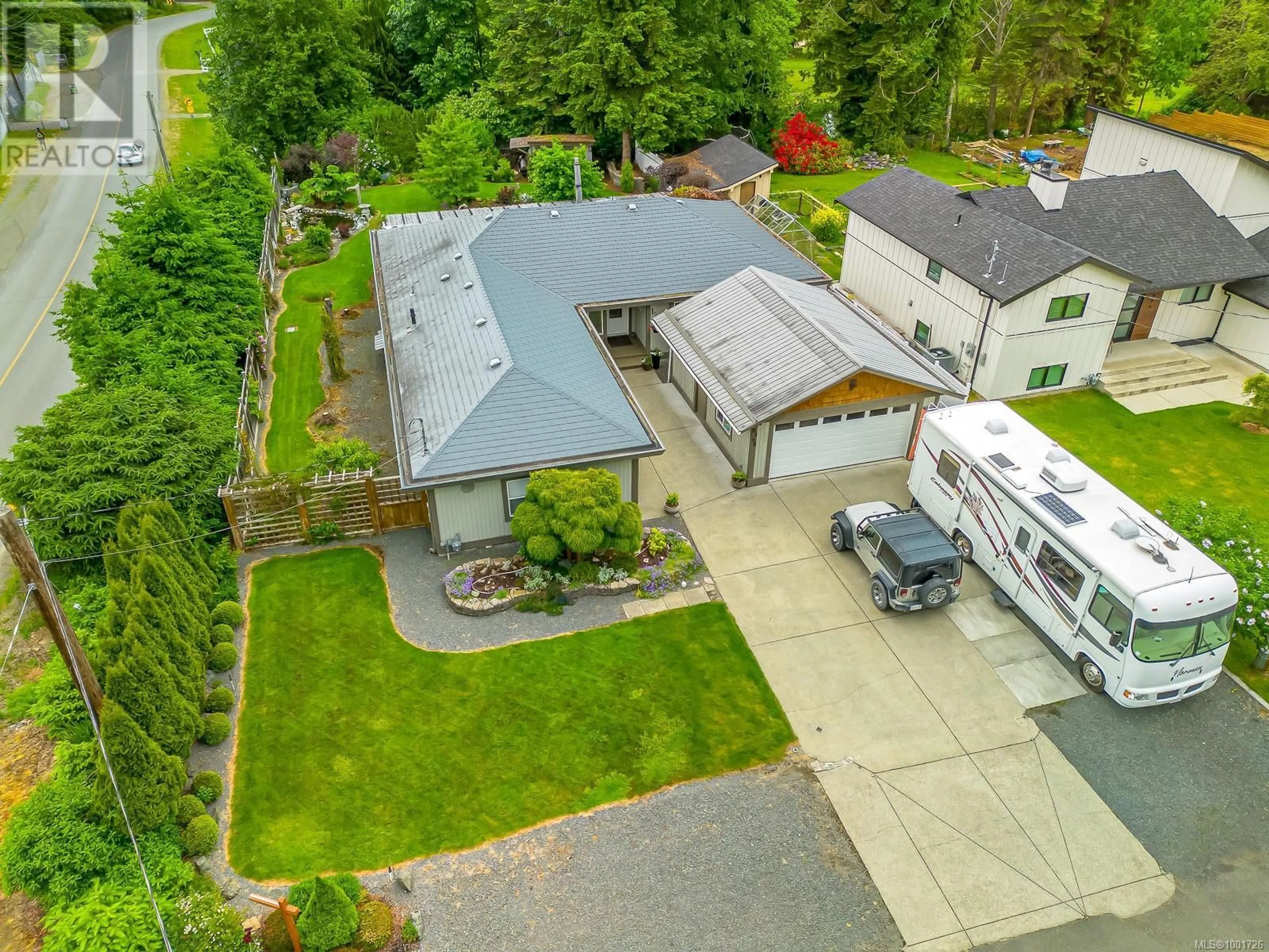 A pic from outside/outdoor area/front of a property/back of a property/a pic from drone, street for 8998 MCLAREY AVENUE, Black Creek British Columbia V9J1A2