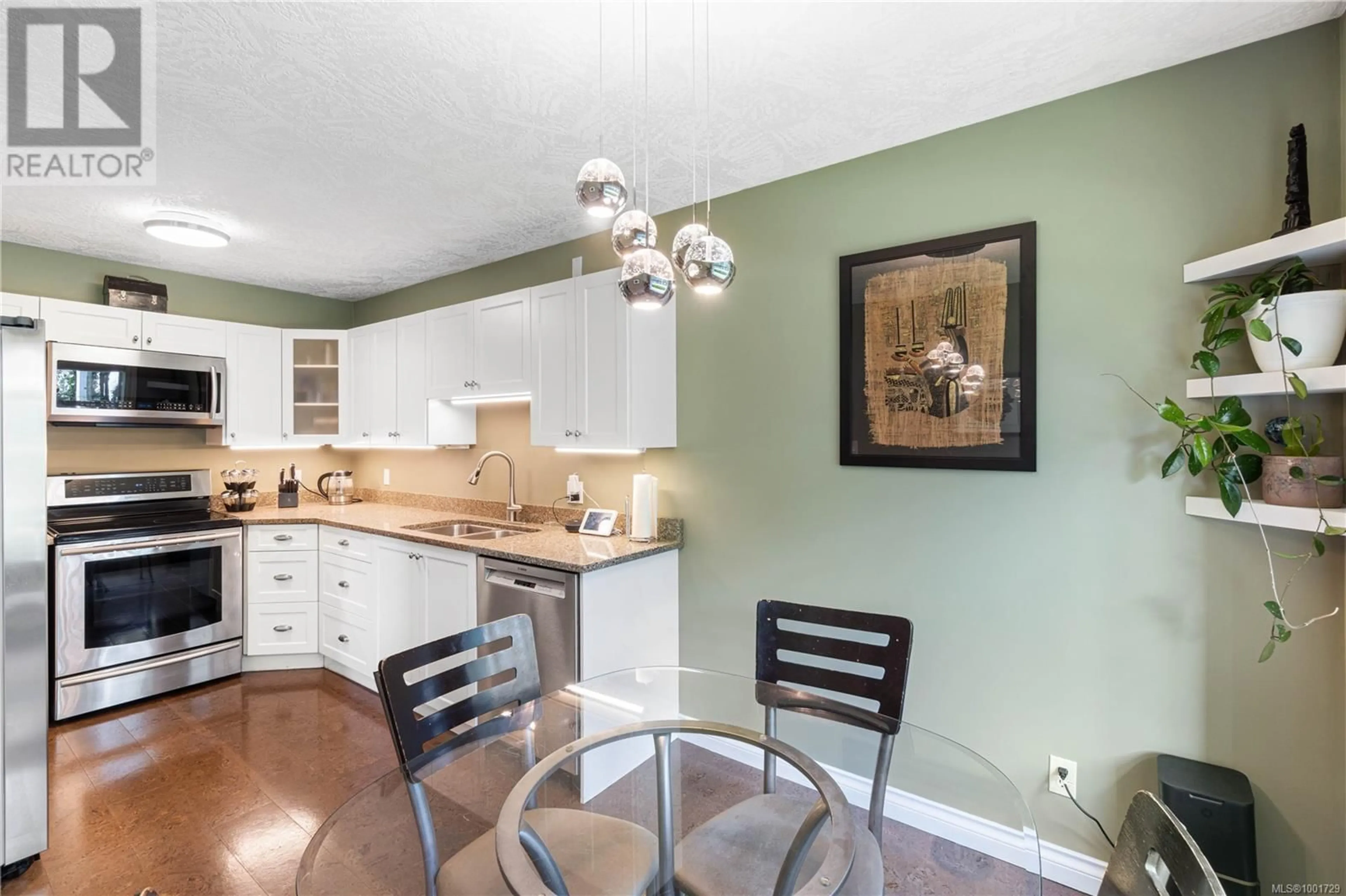 Open concept kitchen, wood/laminate floor for 202 - 2 DORIC AVENUE, Nanaimo British Columbia V9R3N1