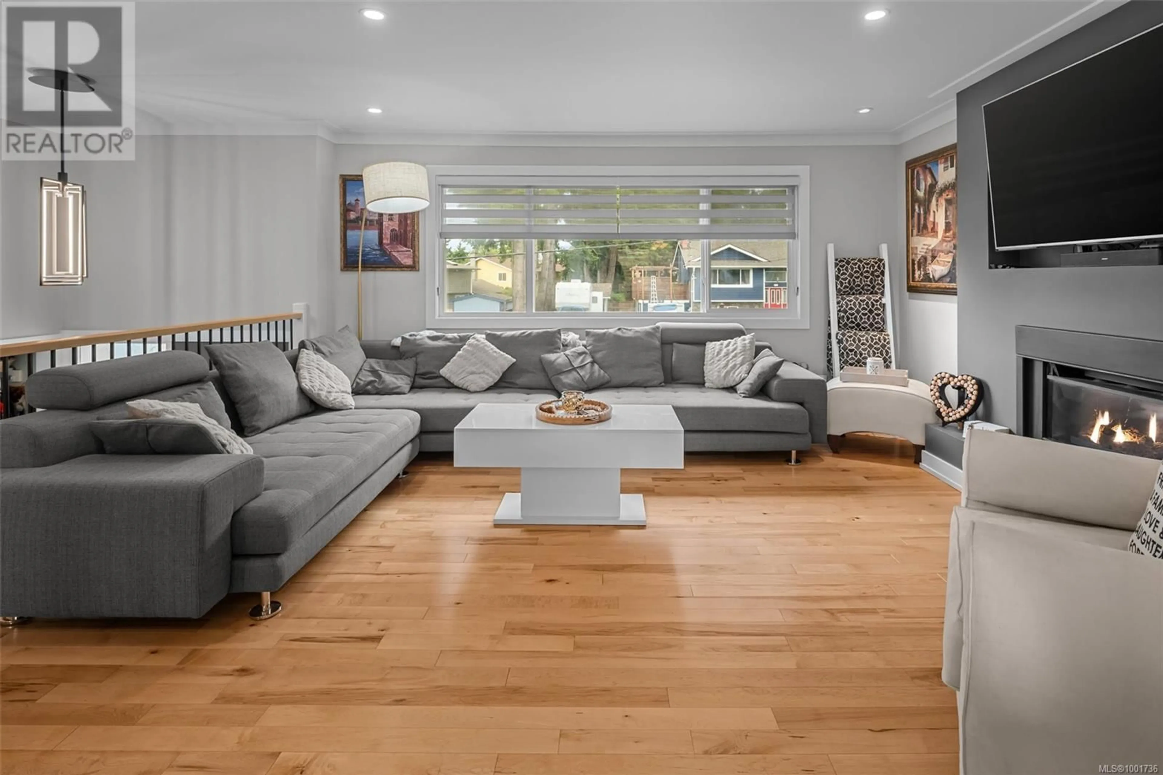 Living room with furniture, wood/laminate floor for 2429 MARLENE DRIVE, Colwood British Columbia V9B4L3