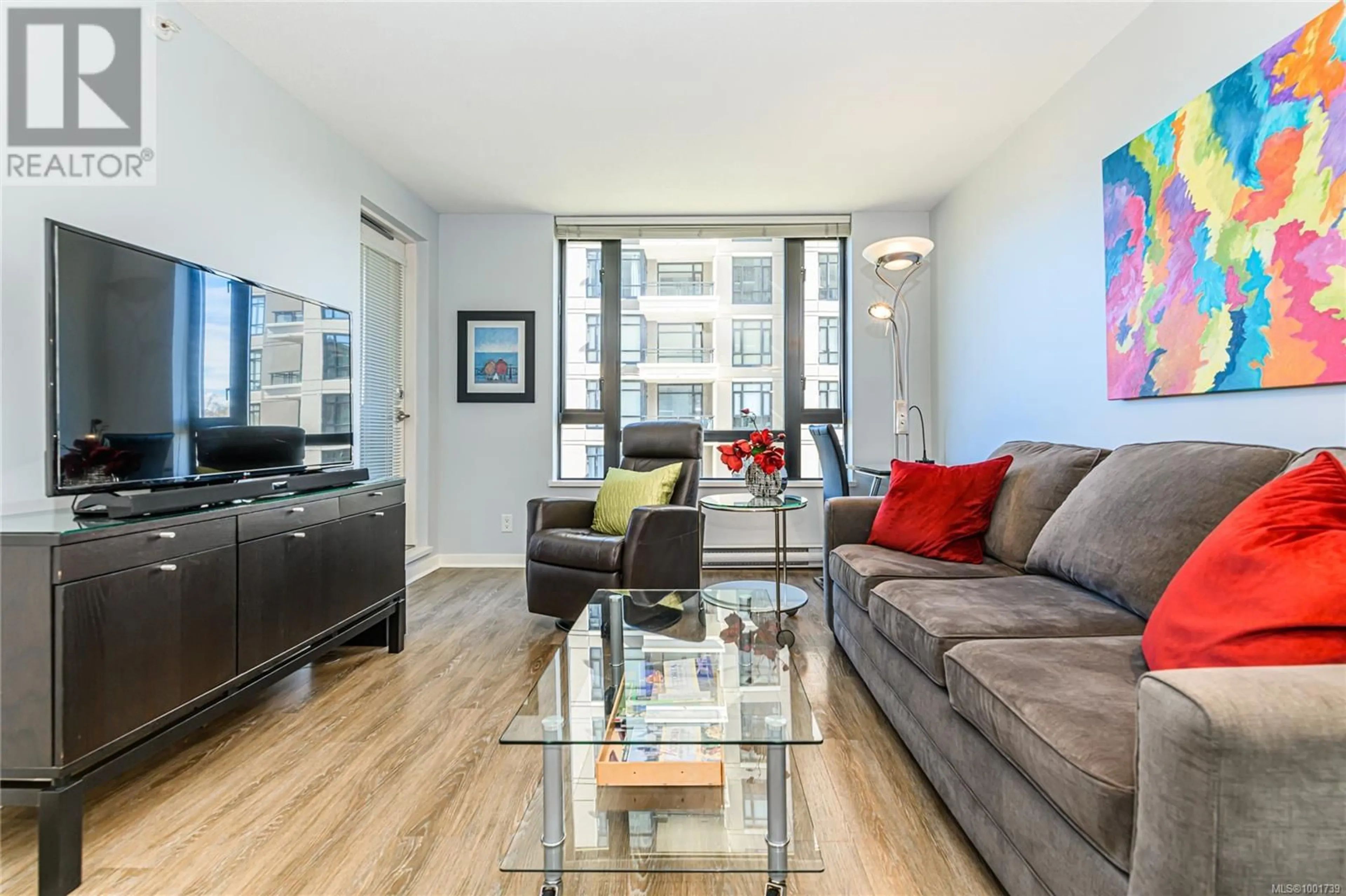 Living room with furniture, wood/laminate floor for 506 - 751 FAIRFIELD ROAD, Victoria British Columbia V8W4A4