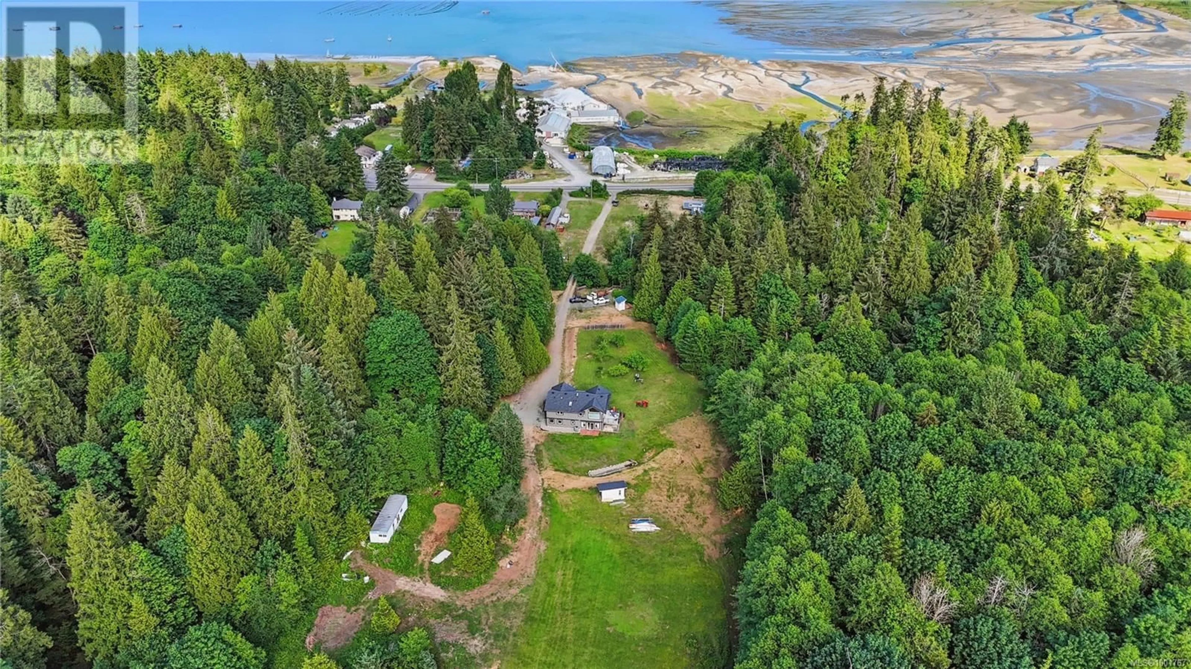 A pic from outside/outdoor area/front of a property/back of a property/a pic from drone, water/lake/river/ocean view for 8271 ISLAND HIGHWAY SOUTH, Fanny Bay British Columbia V0R1W0