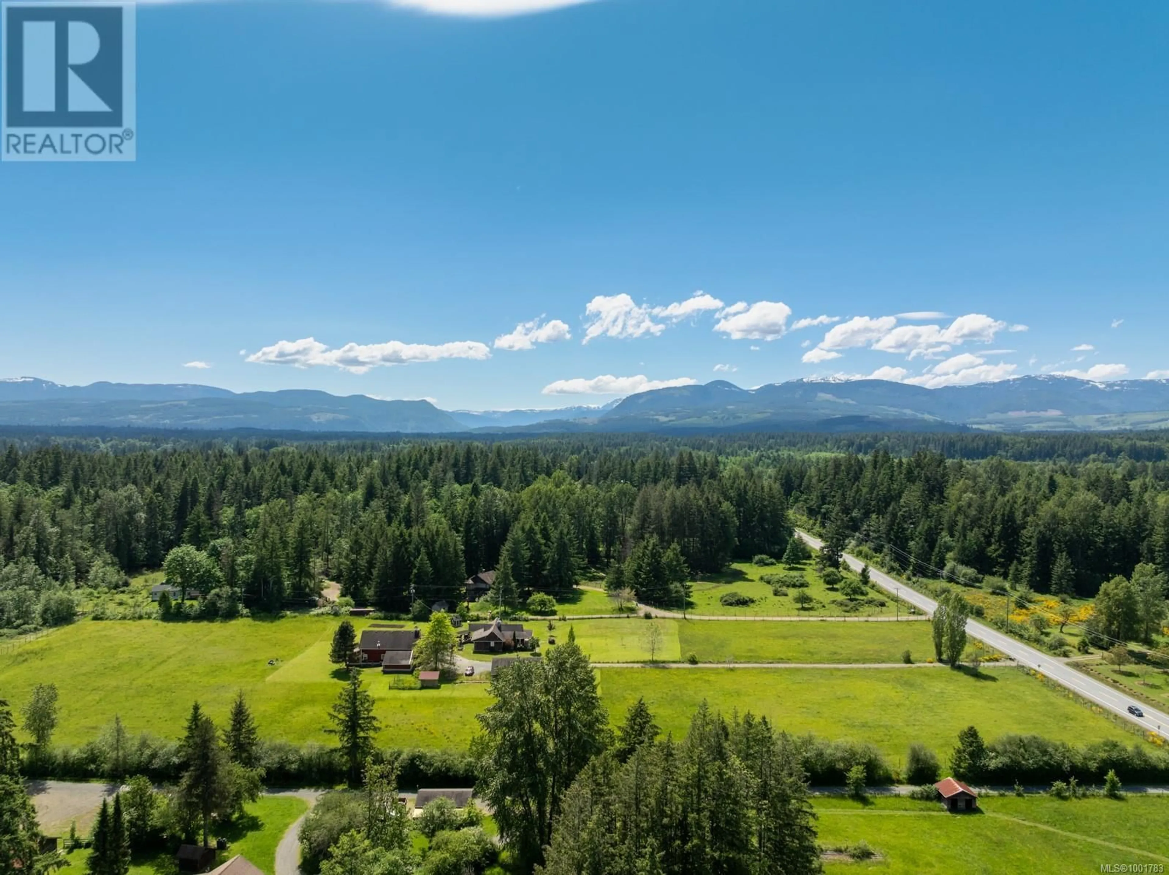 A pic from outside/outdoor area/front of a property/back of a property/a pic from drone, mountain view for 3701 PIERCY ROAD, Courtenay British Columbia V9J1R7