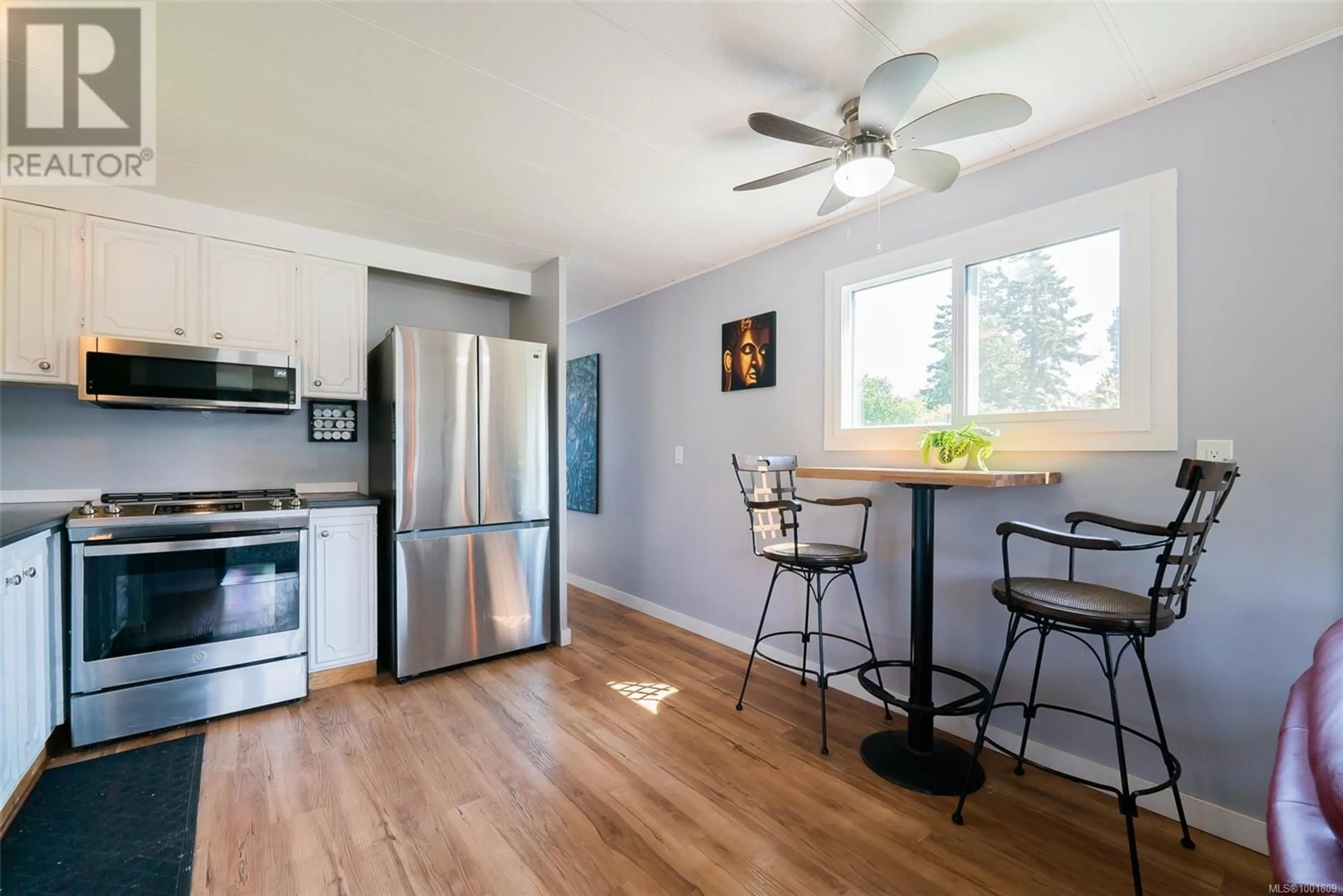 Open concept kitchen, wood/laminate floor for 48 HONEY DRIVE, Nanaimo British Columbia V9R5N1