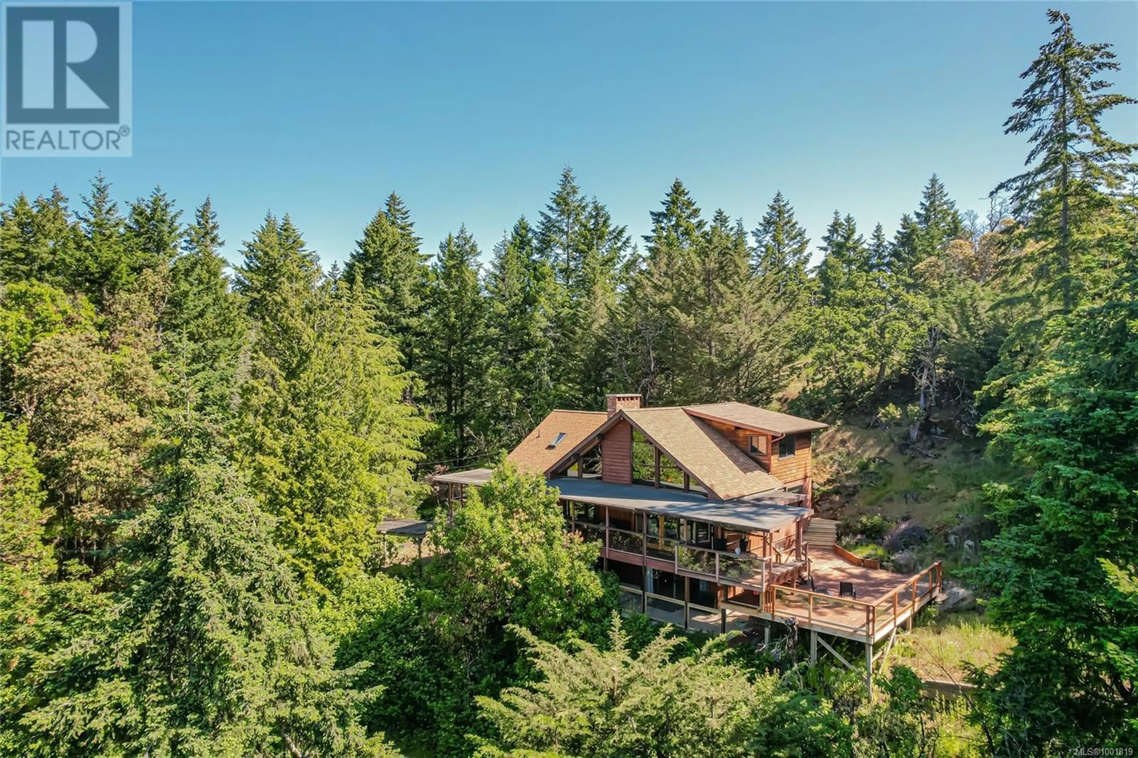 A pic from outside/outdoor area/front of a property/back of a property/a pic from drone, forest/trees view for 119 AGAR ROAD, Salt Spring British Columbia V8K1J7