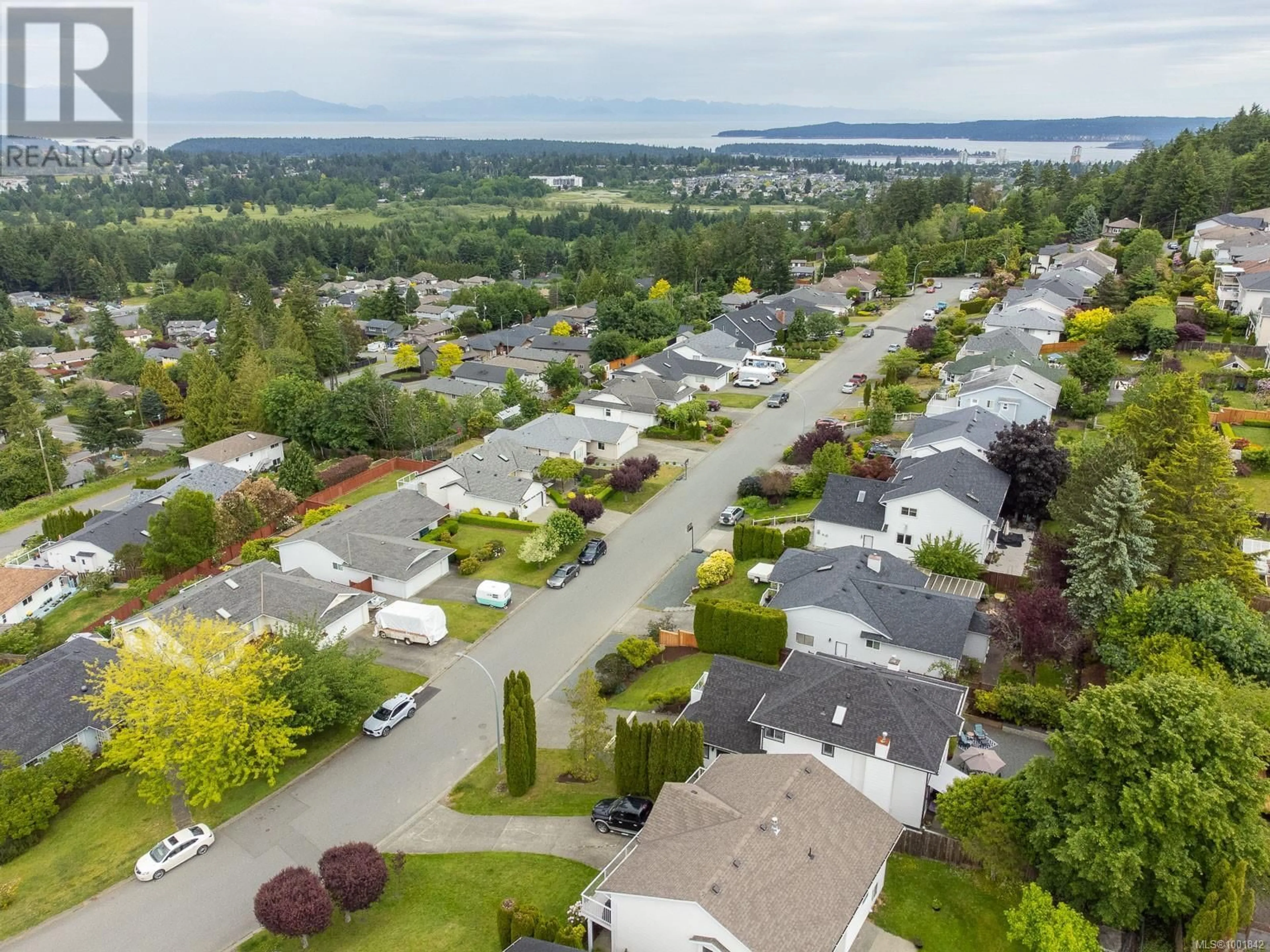 A pic from outside/outdoor area/front of a property/back of a property/a pic from drone, street for 2177 WOODTHRUSH PLACE, Nanaimo British Columbia V9R6V2
