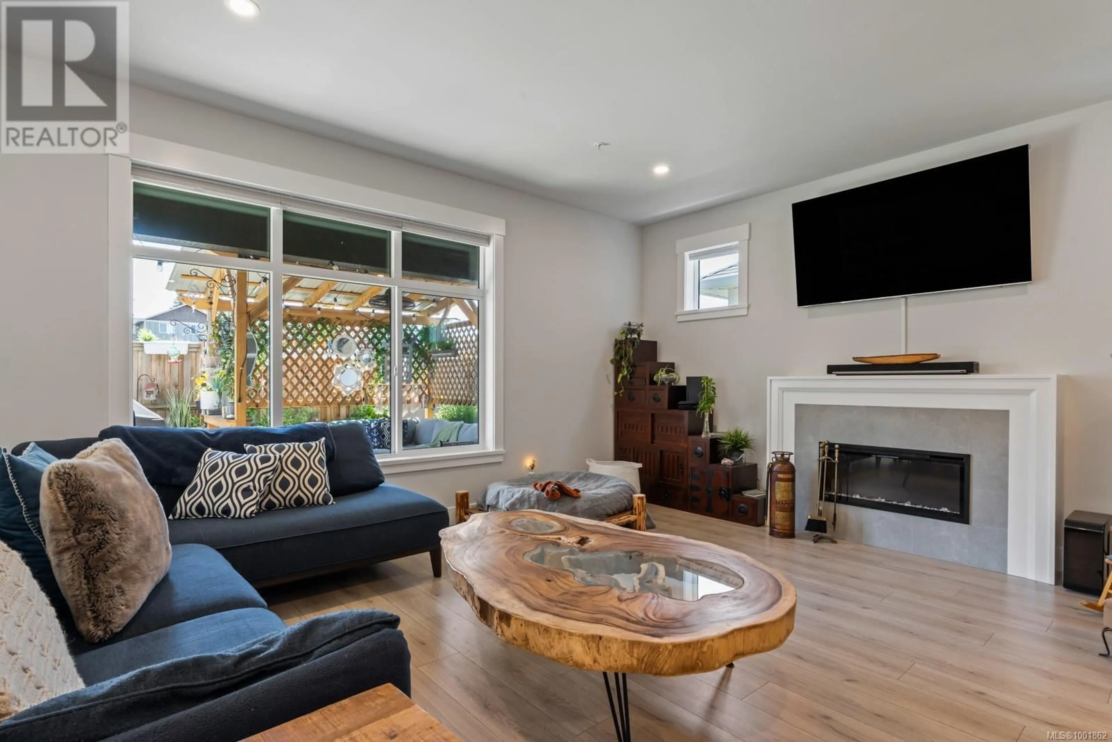Living room with furniture, wood/laminate floor for 6541 NOBLEWOOD PLACE, Sooke British Columbia V9Z0W3