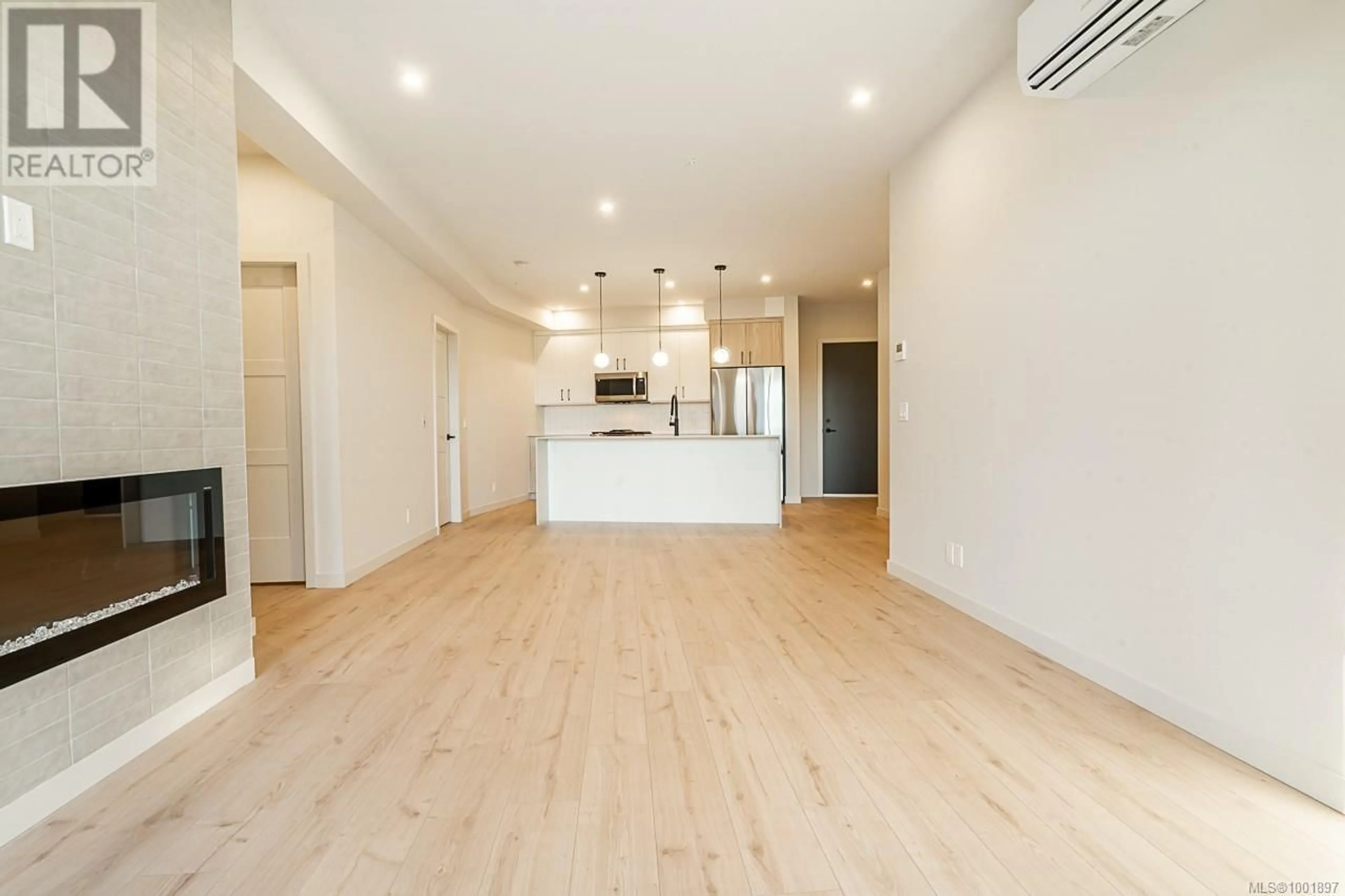 Open concept kitchen, wood/laminate floor for 510 - 958 PHAROAH MEWS, Langford British Columbia V9B7A1