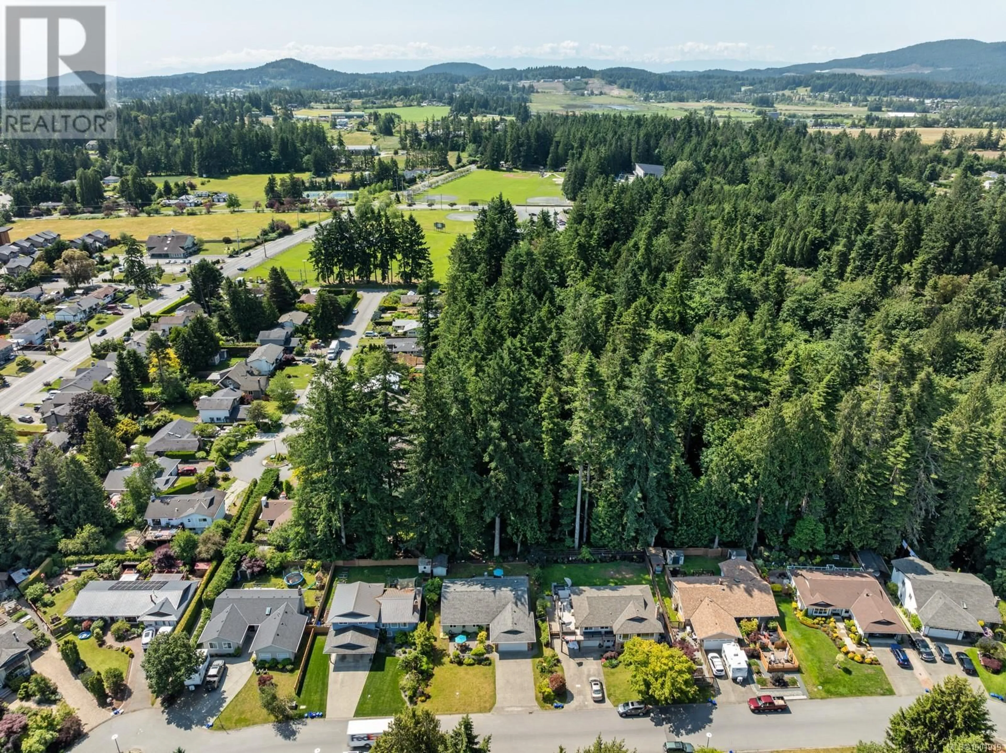A pic from outside/outdoor area/front of a property/back of a property/a pic from drone, forest/trees view for 1837 PASTEL CRESCENT, Central Saanich British Columbia V8M1N6