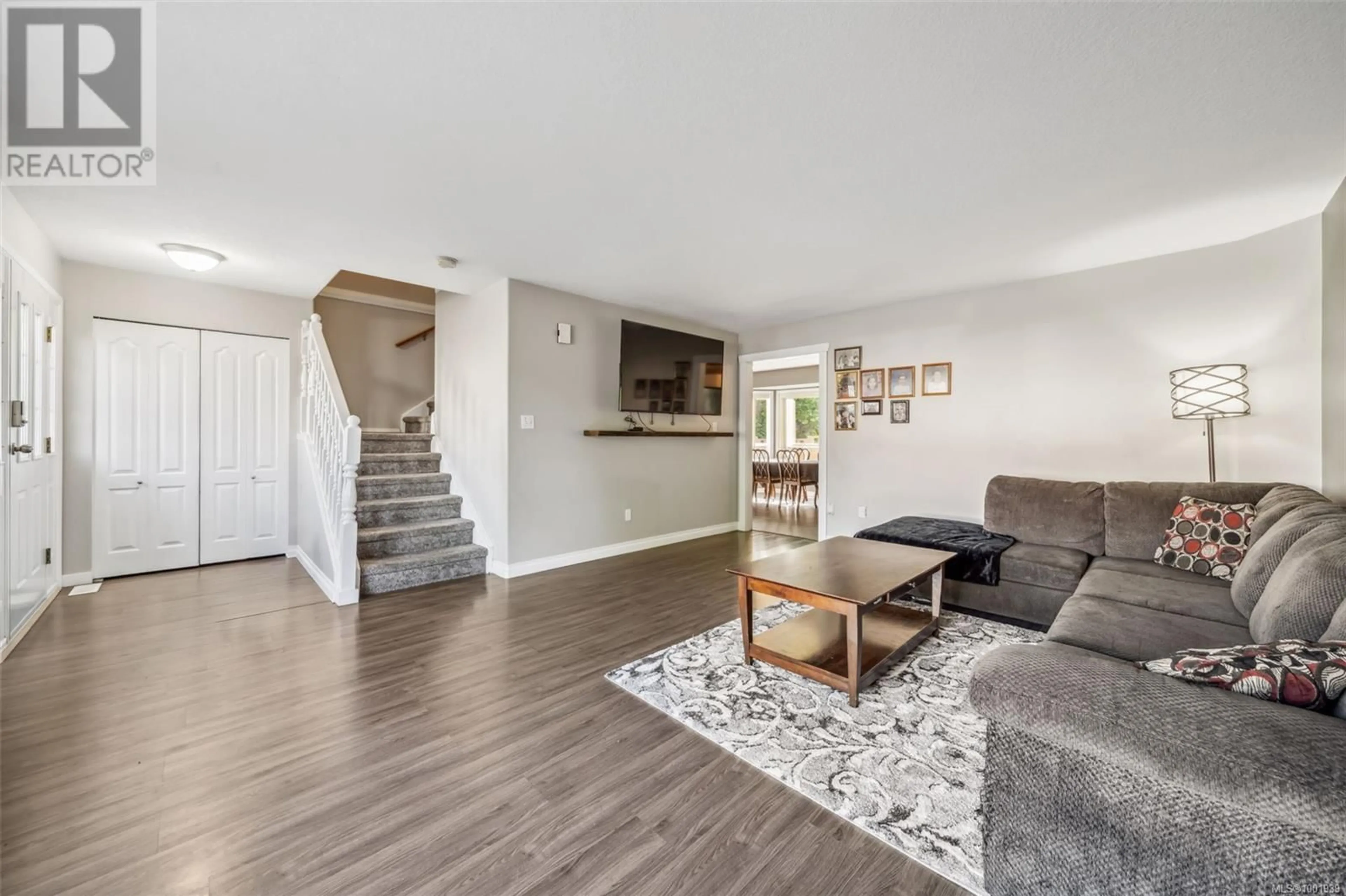 Living room with furniture, wood/laminate floor for 6066 TRUESDALE STREET, Duncan British Columbia V9L2J2