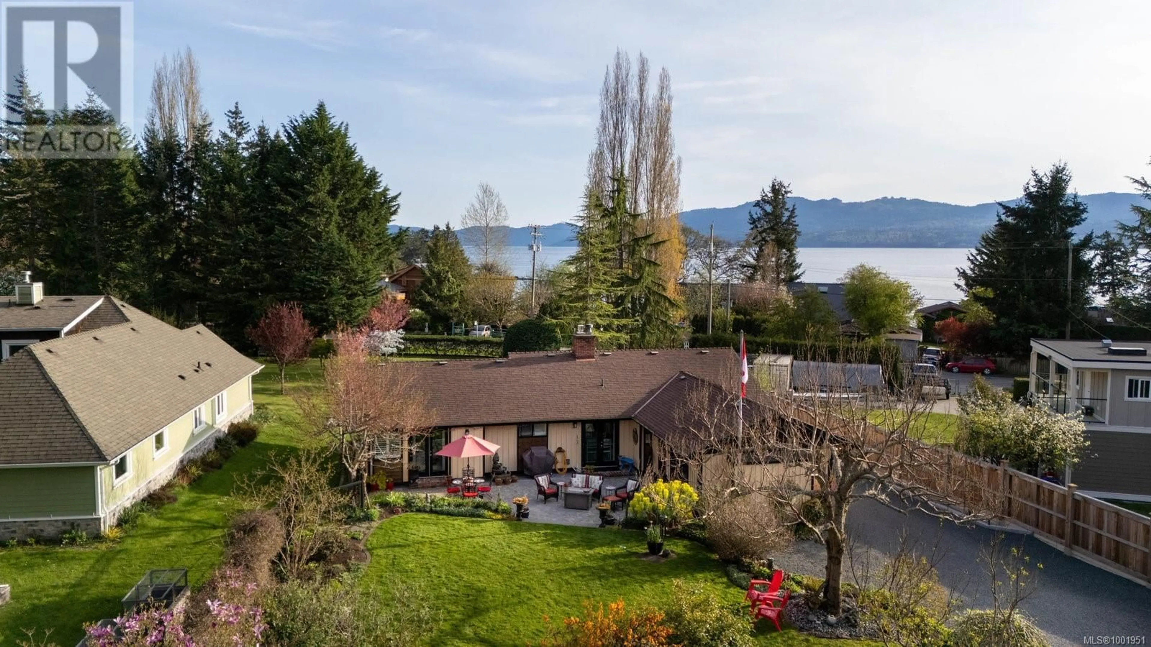 A pic from outside/outdoor area/front of a property/back of a property/a pic from drone, water/lake/river/ocean view for 10807 MADRONA DRIVE, North Saanich British Columbia V8L5P1