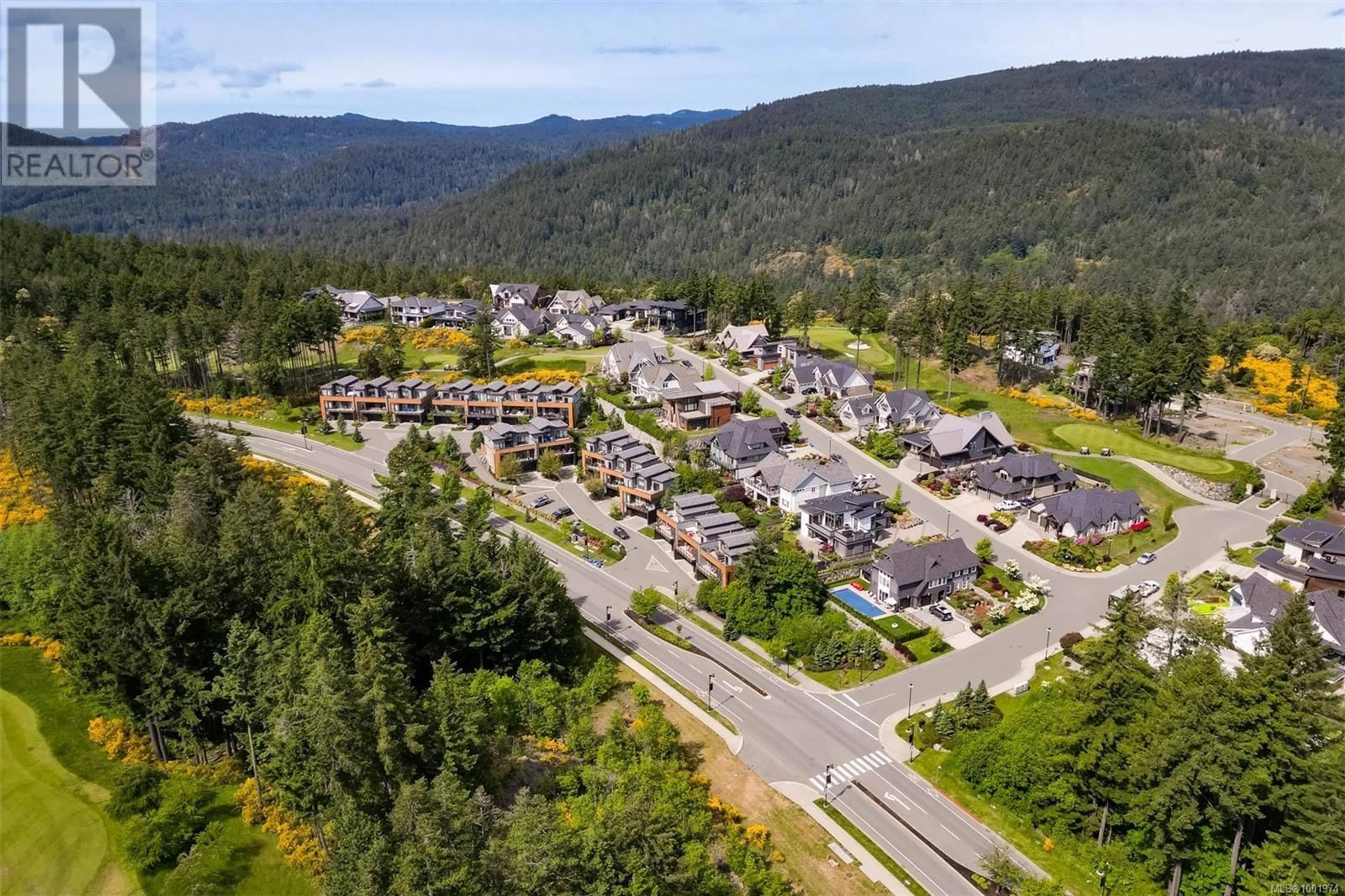 A pic from outside/outdoor area/front of a property/back of a property/a pic from drone, mountain view for 104 - 1454 BEAR MOUNTAIN PARKWAY, Langford British Columbia V9B0V5