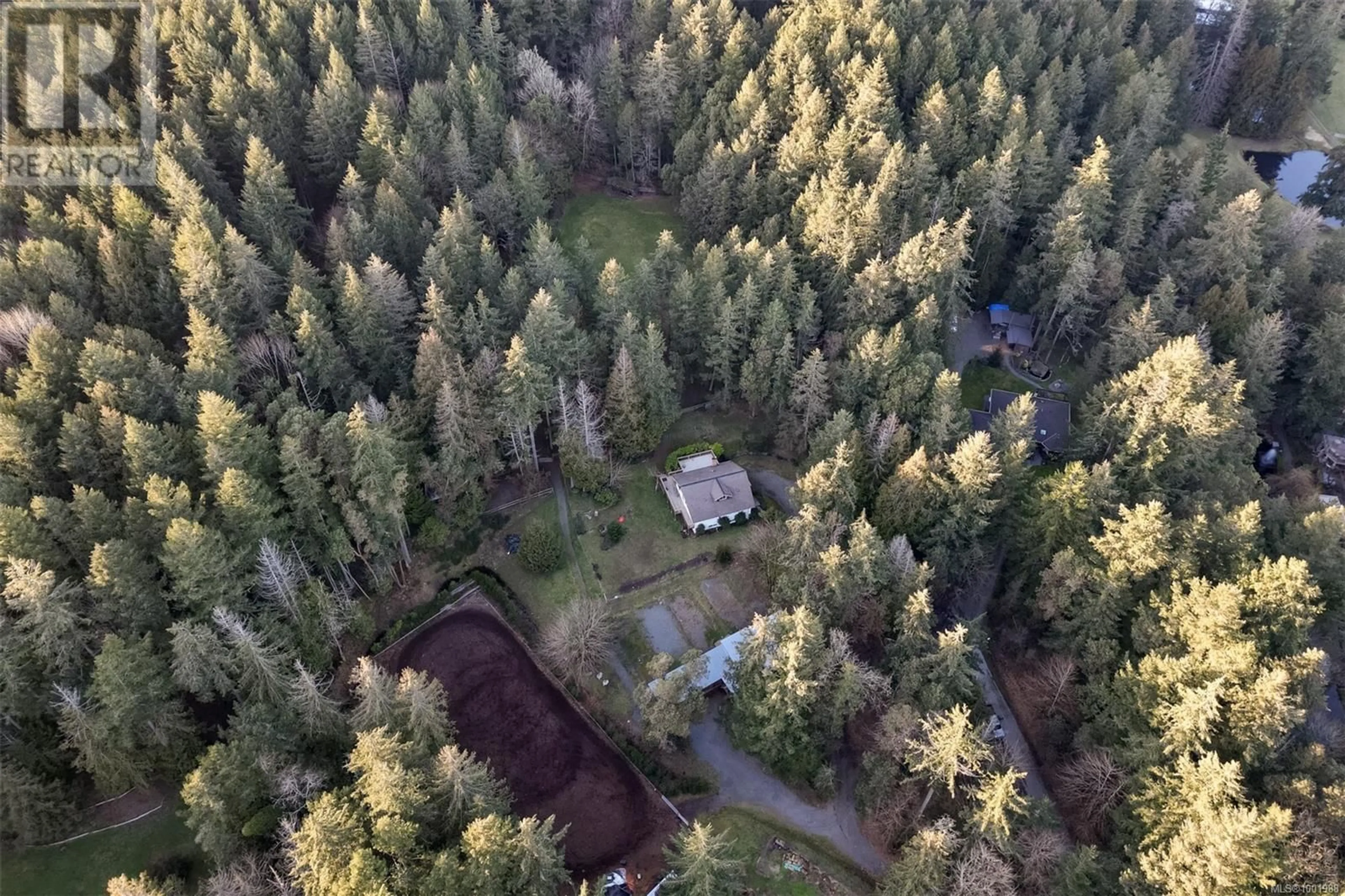 A pic from outside/outdoor area/front of a property/back of a property/a pic from drone, forest/trees view for 5790 BROOKHILL ROAD, Saanich British Columbia V9E2A5