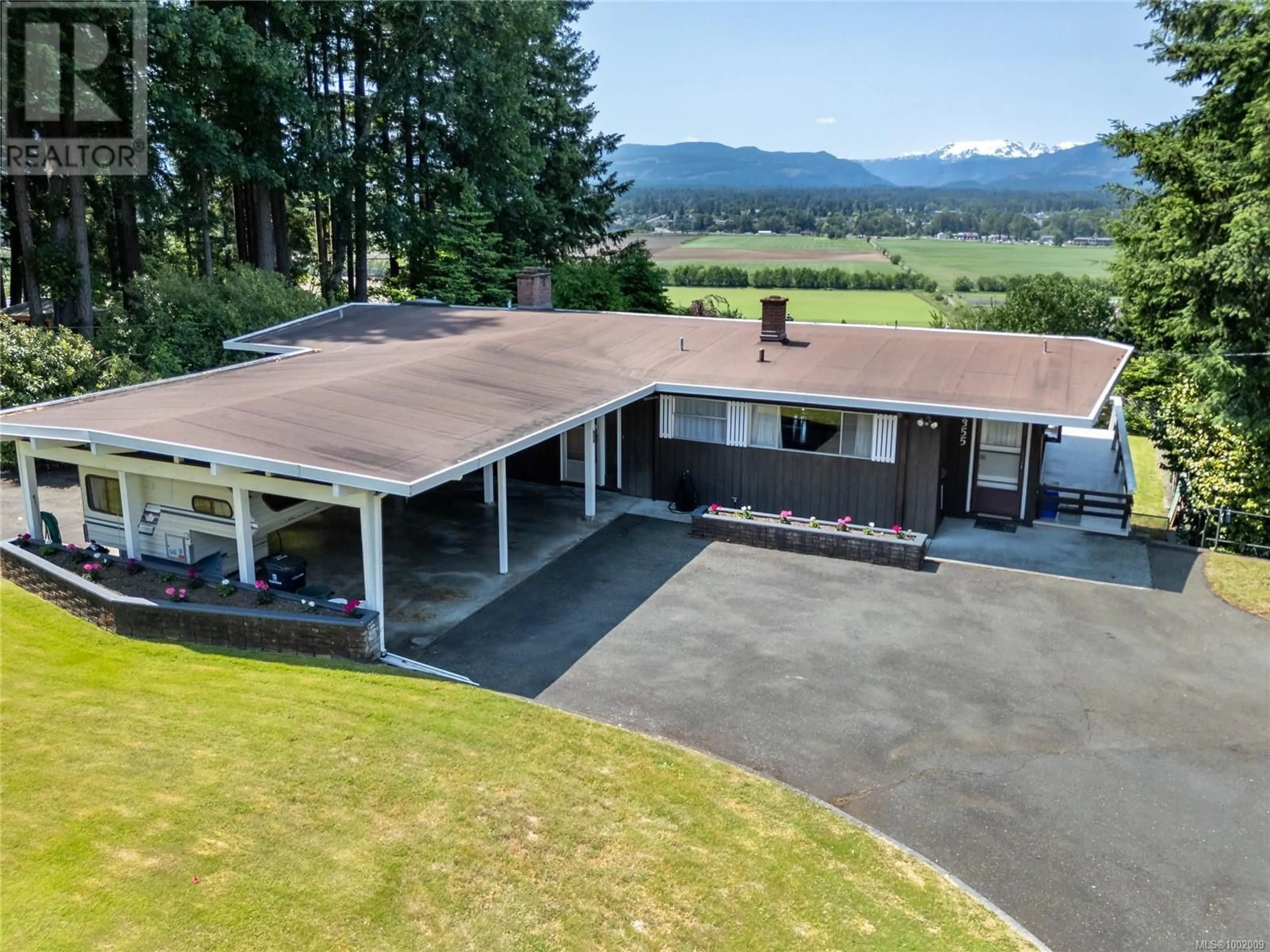 A pic from outside/outdoor area/front of a property/back of a property/a pic from drone, mountain view for 1355 GLEN URQUHART DRIVE, Courtenay British Columbia V9N3Y3