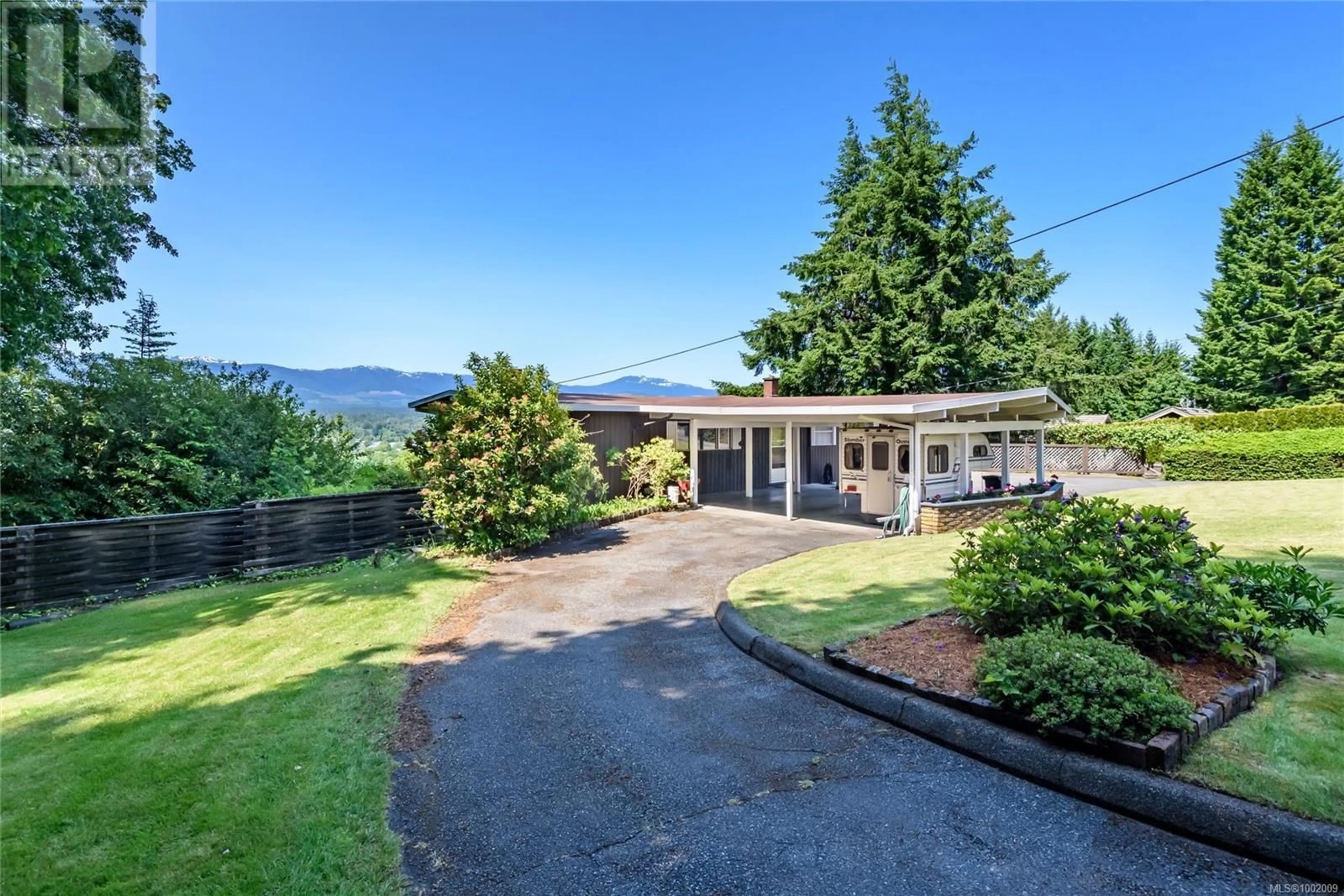 A pic from outside/outdoor area/front of a property/back of a property/a pic from drone, mountain view for 1355 GLEN URQUHART DRIVE, Courtenay British Columbia V9N3Y3