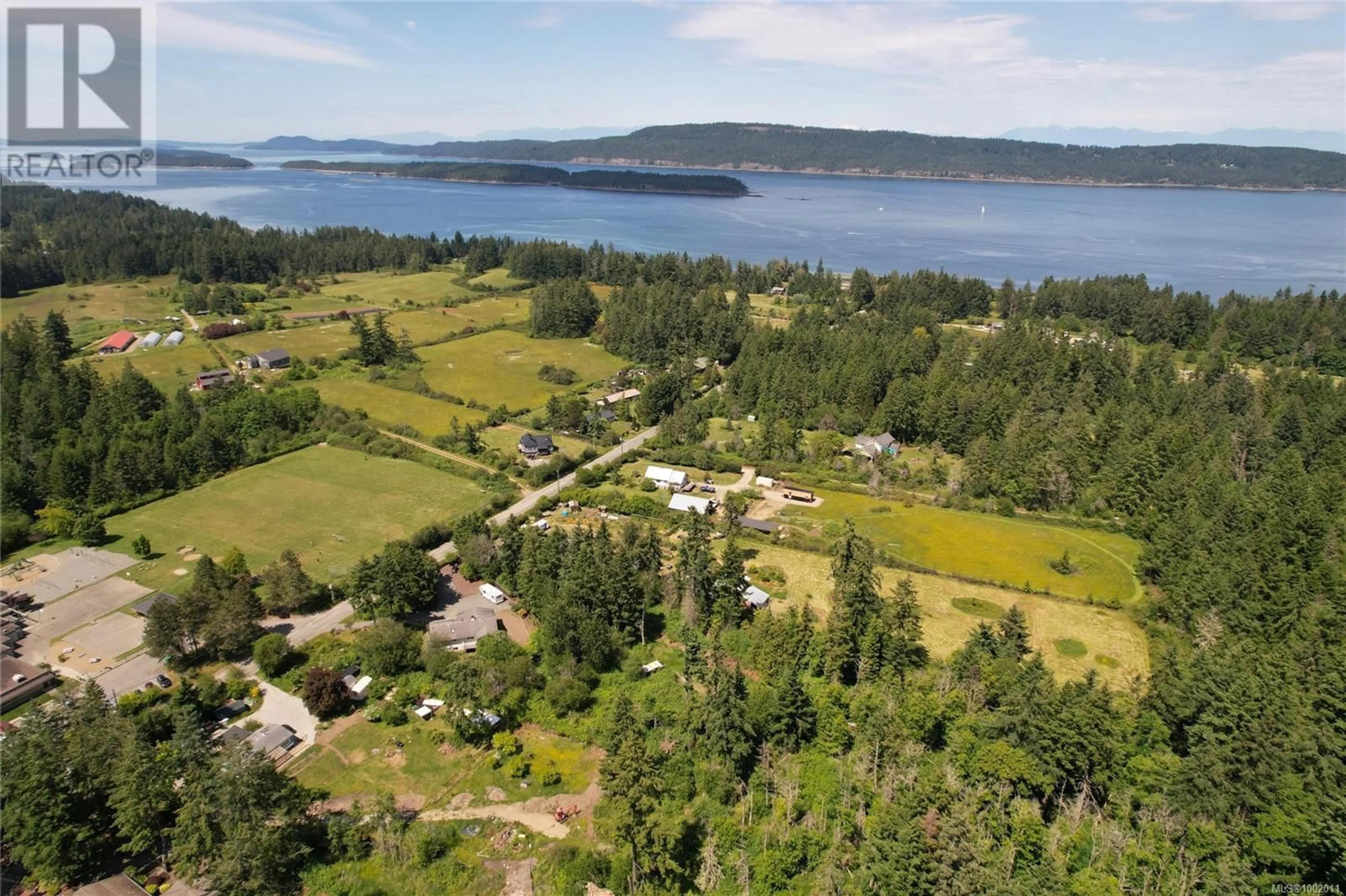 A pic from outside/outdoor area/front of a property/back of a property/a pic from drone, water/lake/river/ocean view for 169 FERNWOOD ROAD, Salt Spring British Columbia V8K1C5