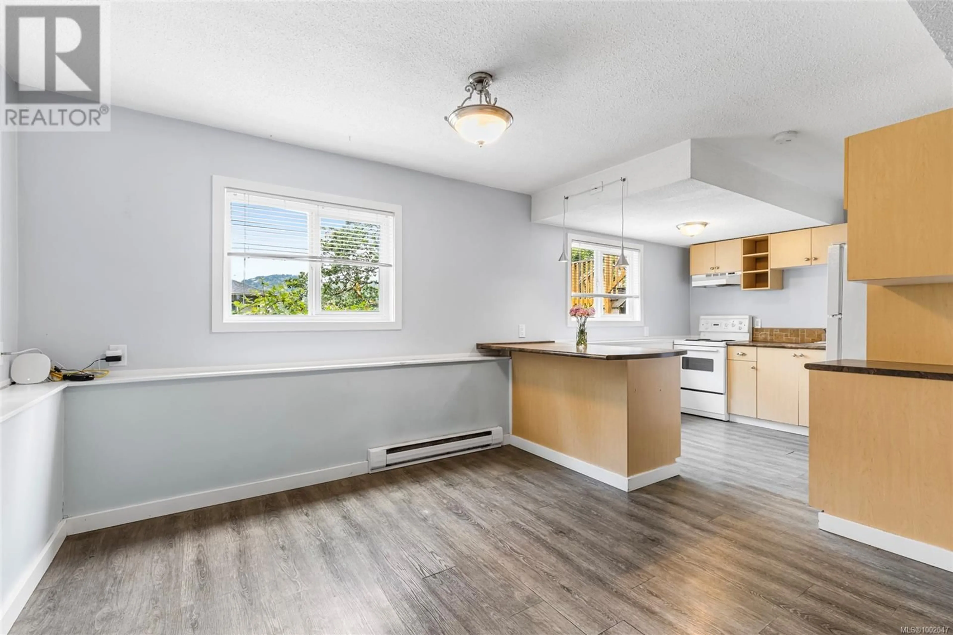 Open concept kitchen, wood/laminate floor for 121 ELROY PLACE, Langford British Columbia V9B3L8