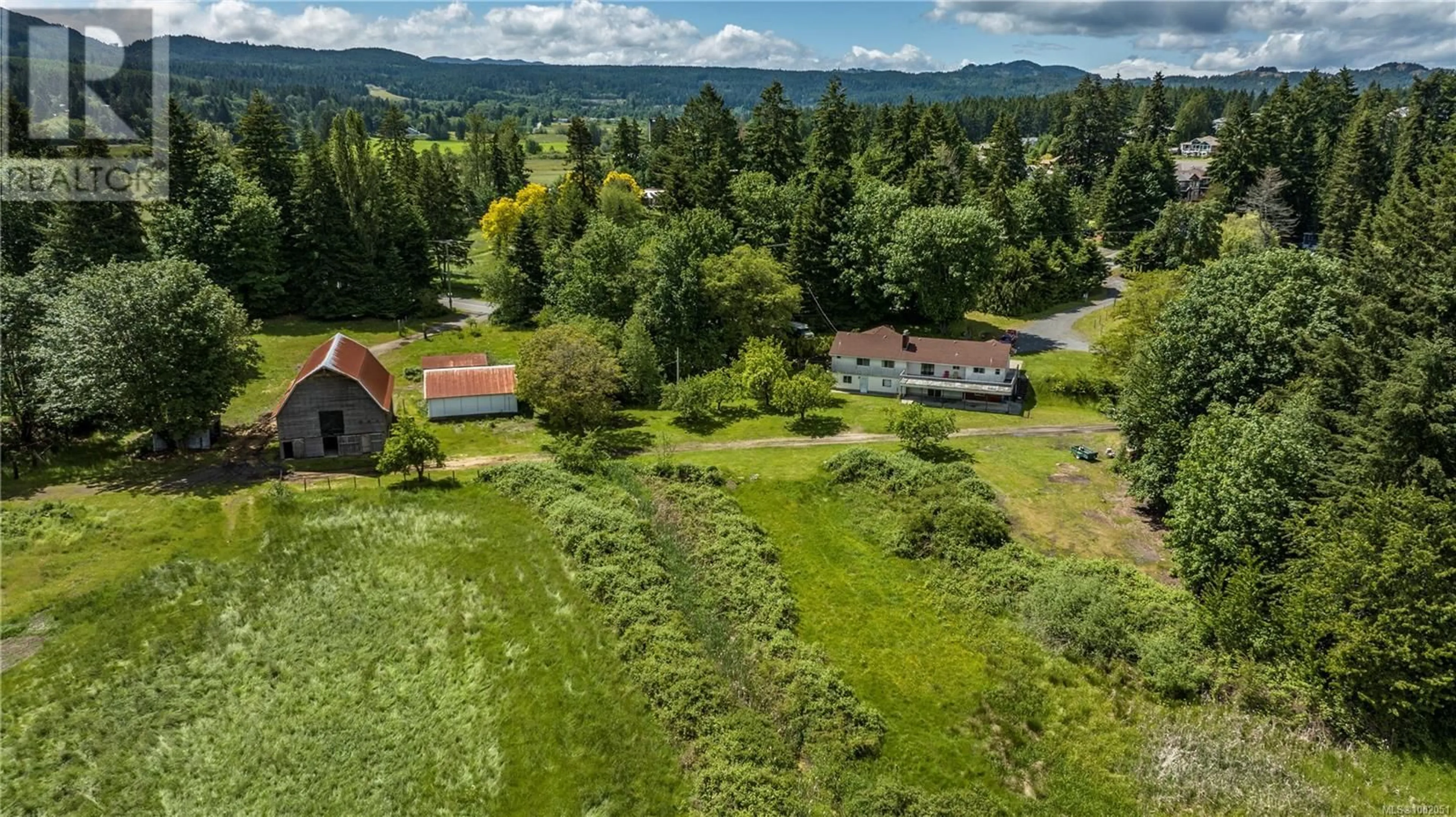 A pic from outside/outdoor area/front of a property/back of a property/a pic from drone, mountain view for 3786 JINGLE POT ROAD, Nanaimo British Columbia V9T5R1