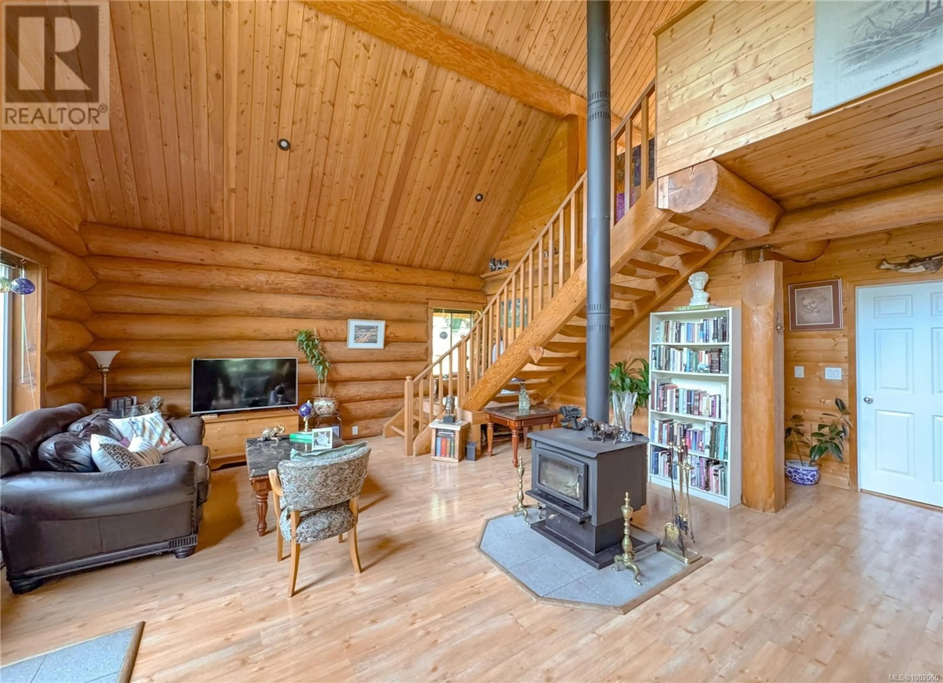 Living room with furniture, wood/laminate floor for 1467 MOBY DICK'S WAY, Gabriola Island British Columbia V0R1X5