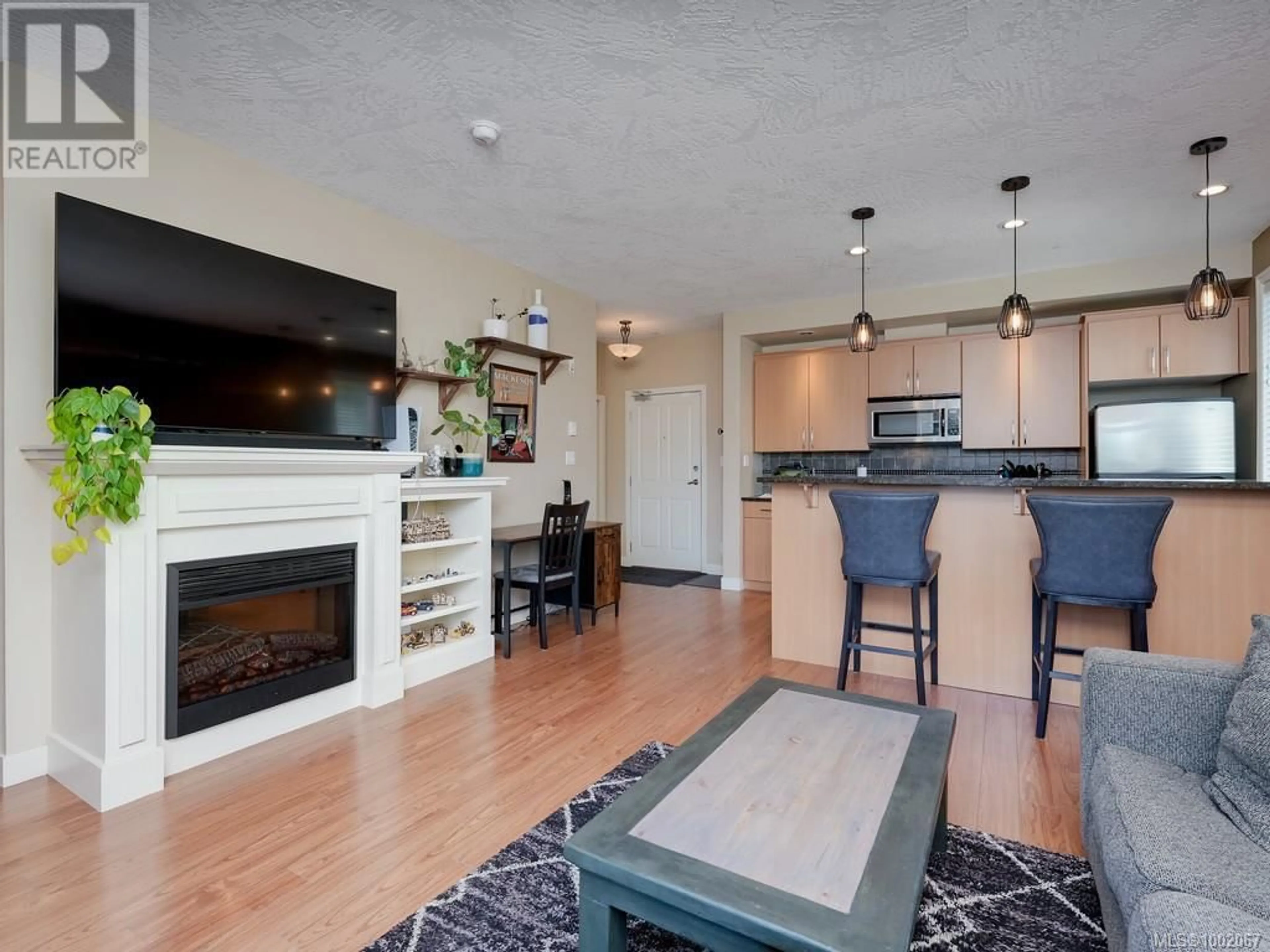 Open concept kitchen, wood/laminate floor for 310 - 623 TREANOR AVENUE, Langford British Columbia V9B0B1